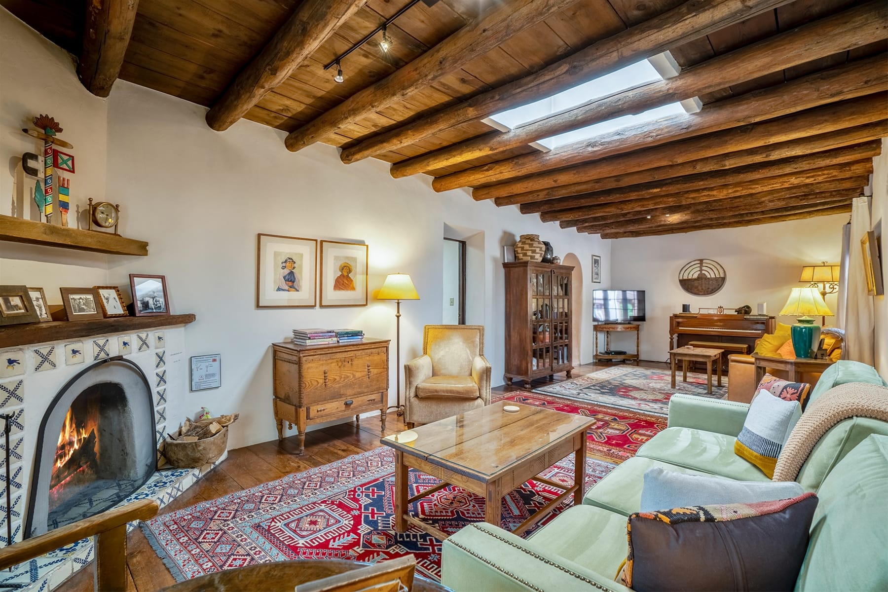 Rustic living room with wooden ceiling.