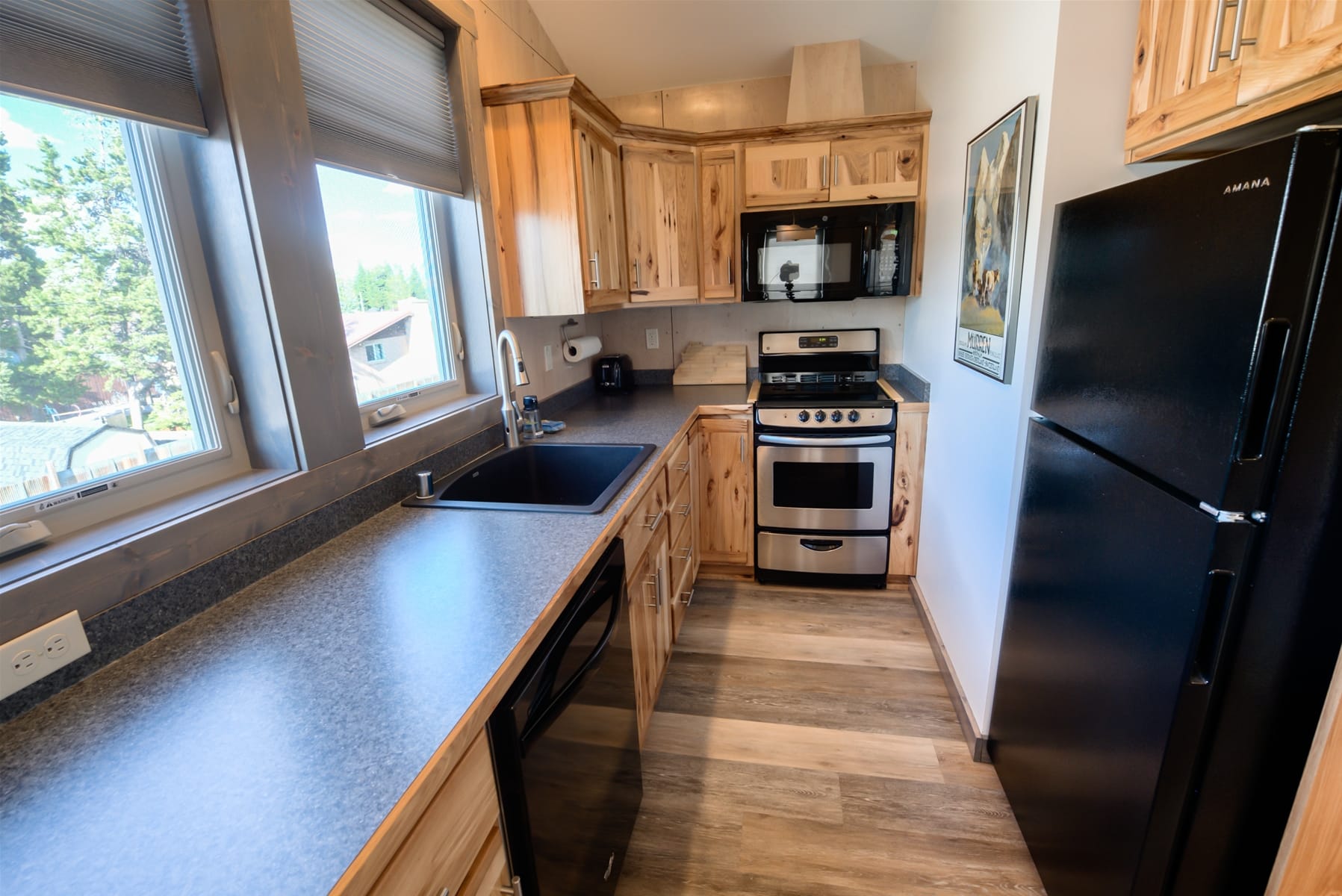 Wooden kitchen with modern appliances.