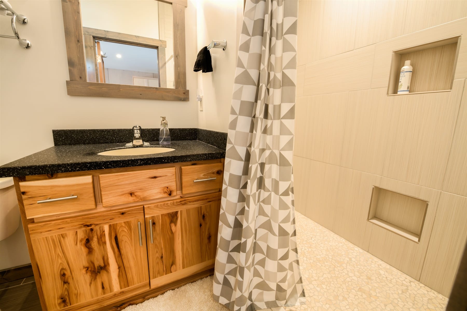 Modern bathroom with wood vanity.