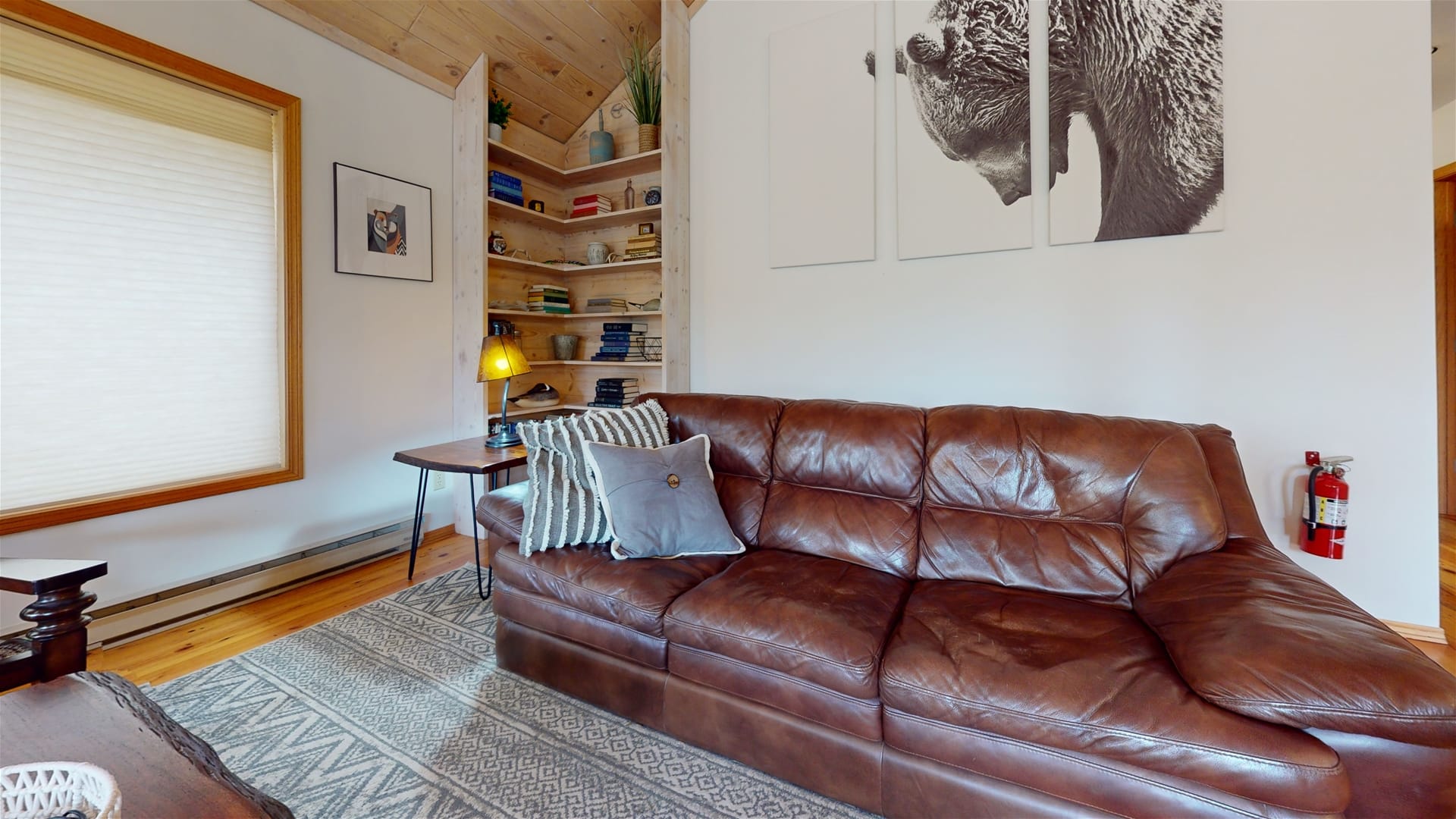 Cozy living room with brown couch.