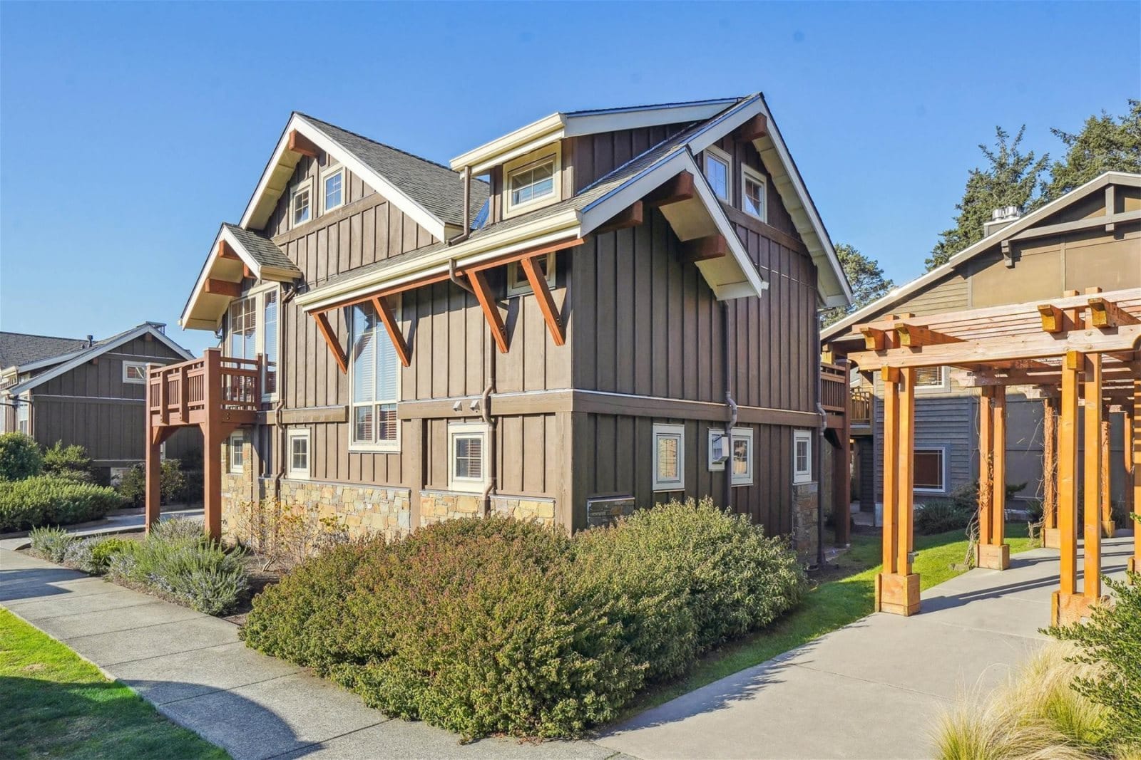 Modern craftsman-style house with pergola.