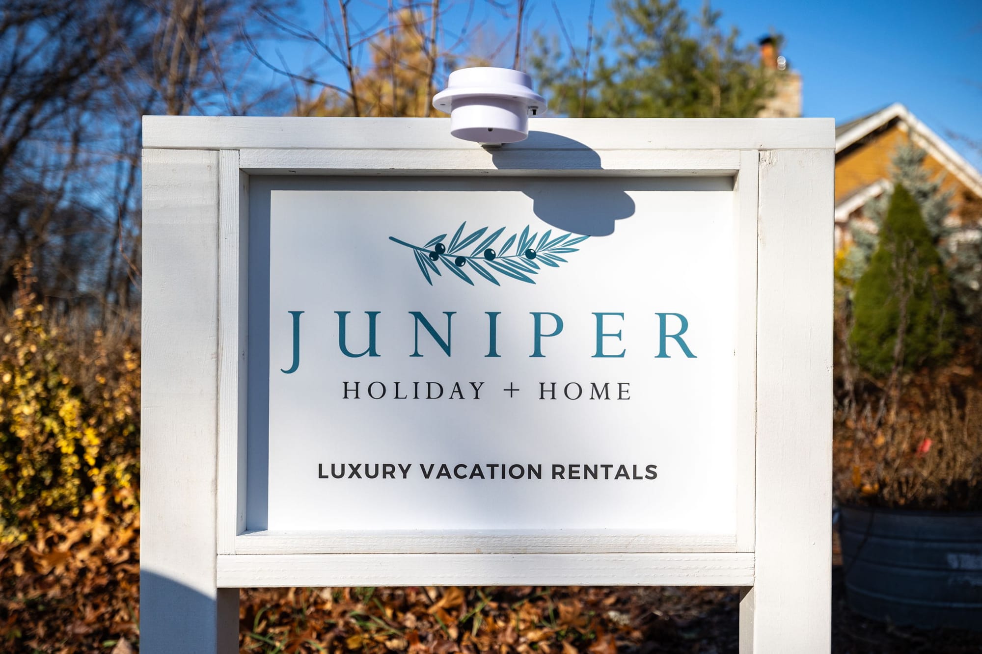 Sign for Juniper luxury vacation rentals.