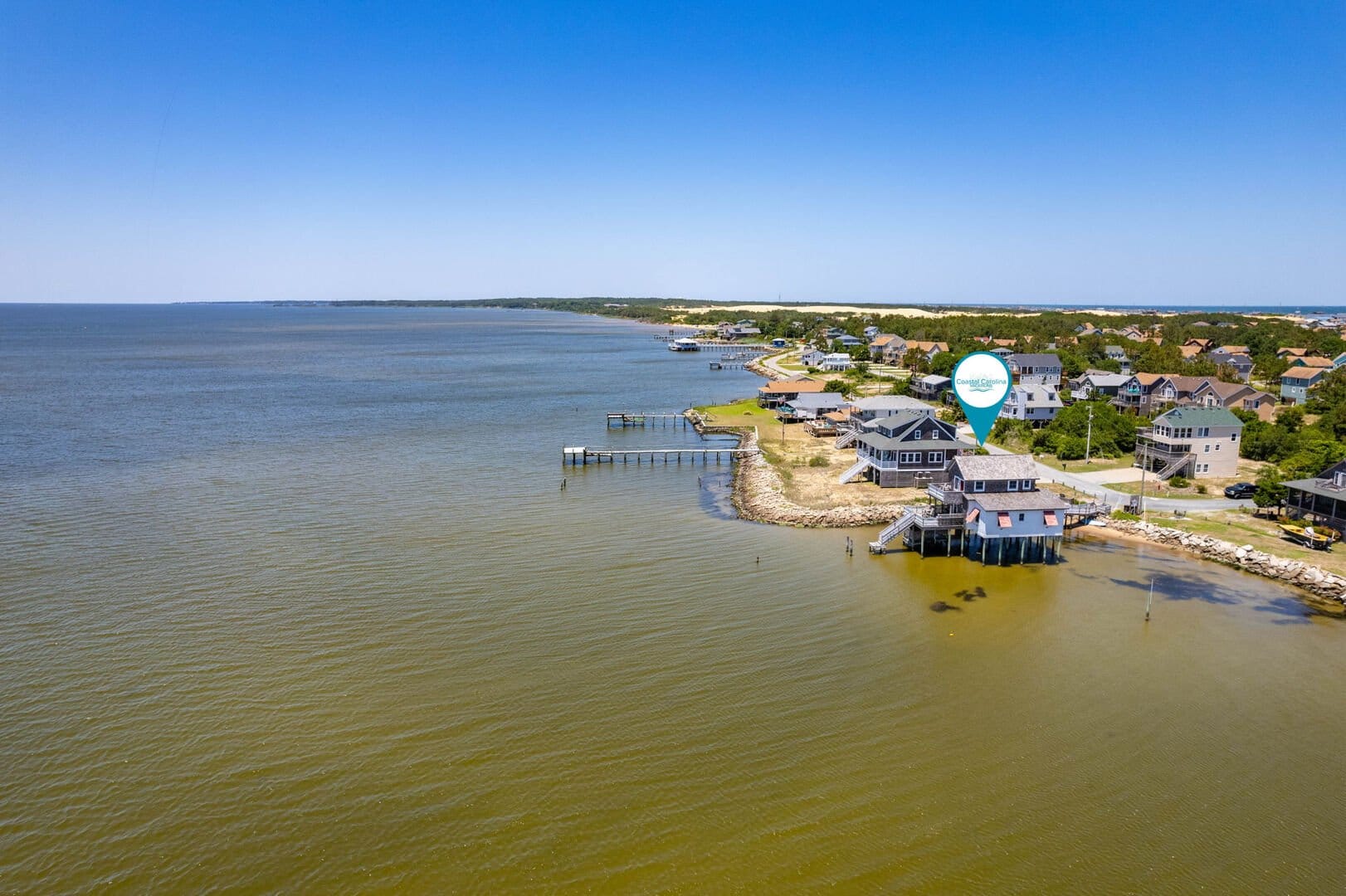 Bayfront homes with piers aerial view.