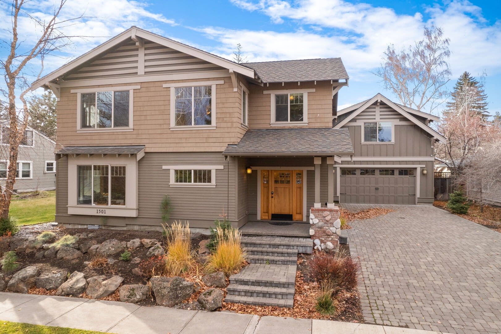 Two-story house with front path.