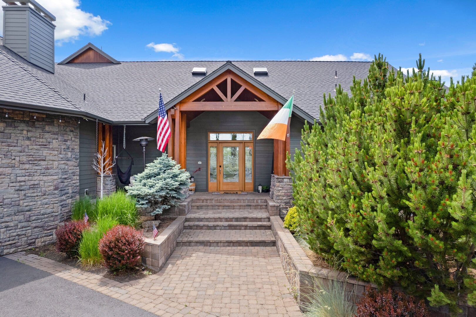 Contemporary house entry with two flags.