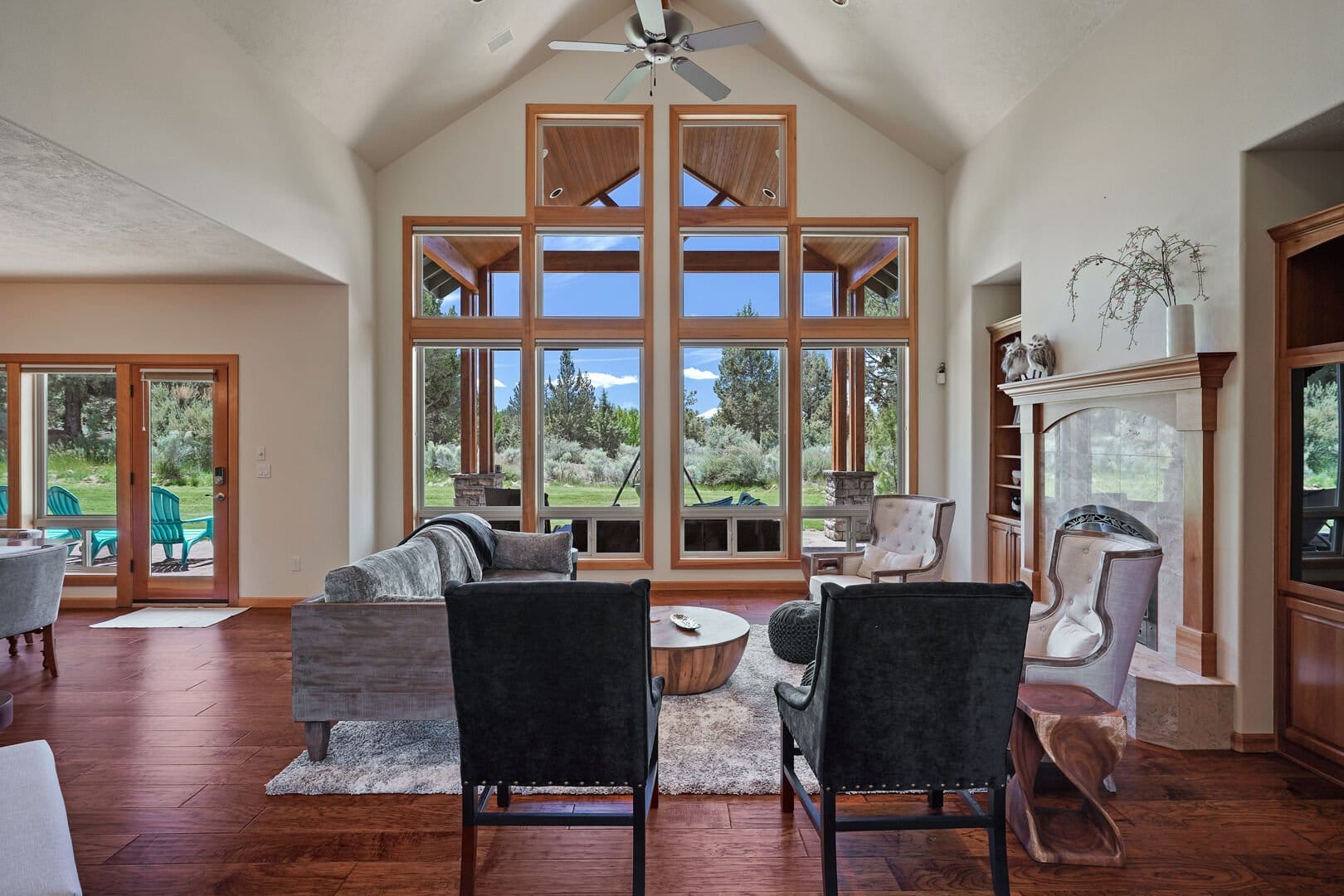 Spacious living room with large windows.