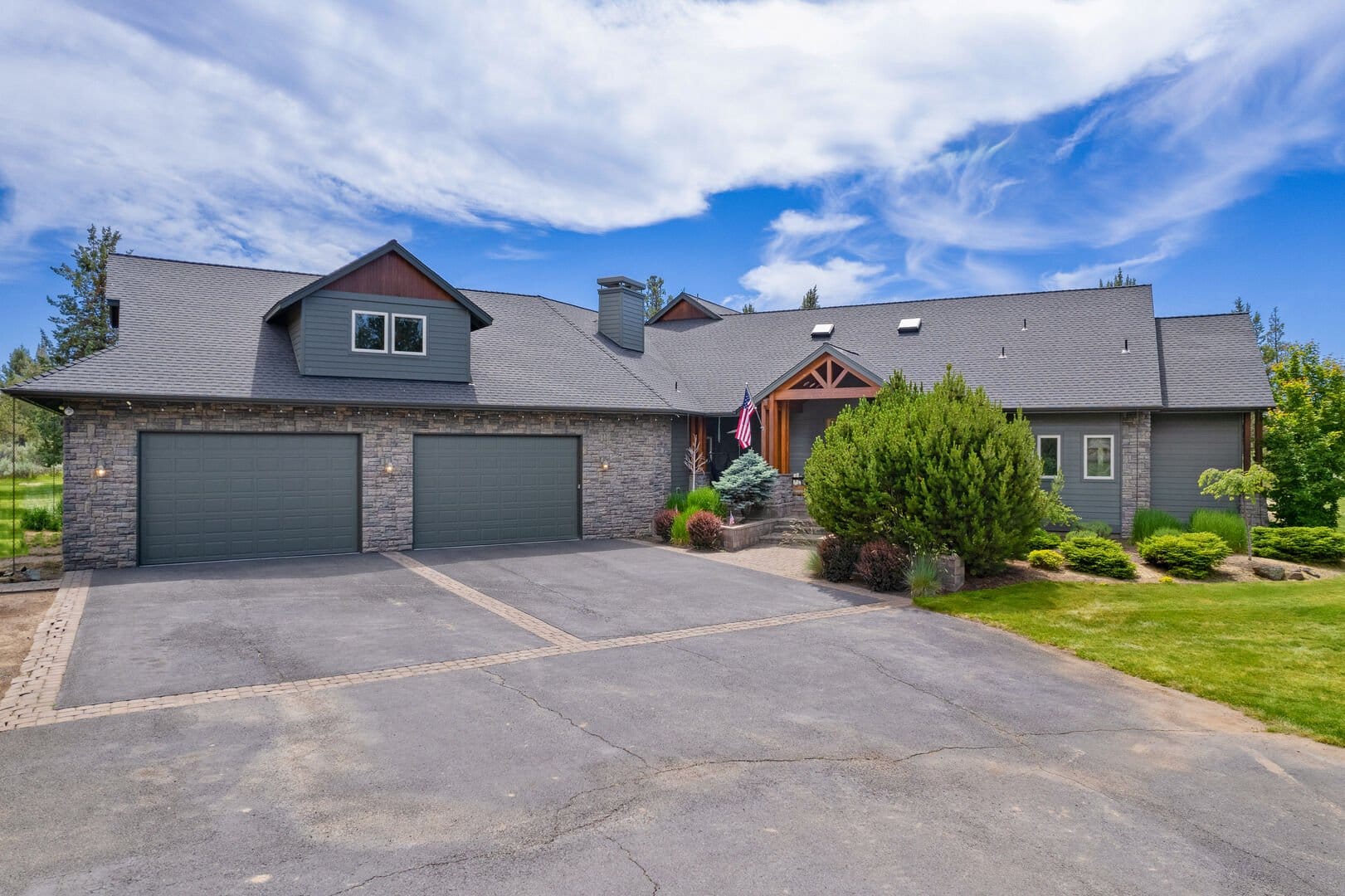 Modern house with three-car garage.