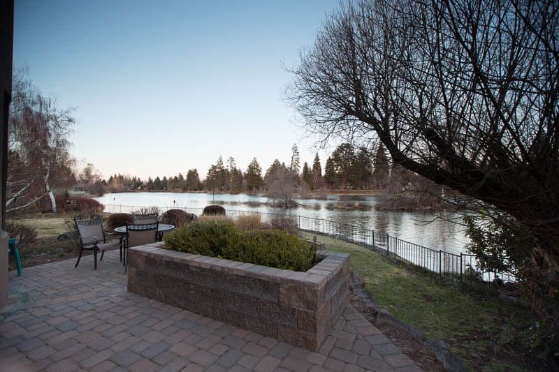 Patio overlooking a serene lake.