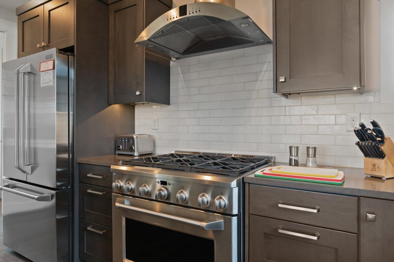 Modern kitchen with stainless steel appliances.