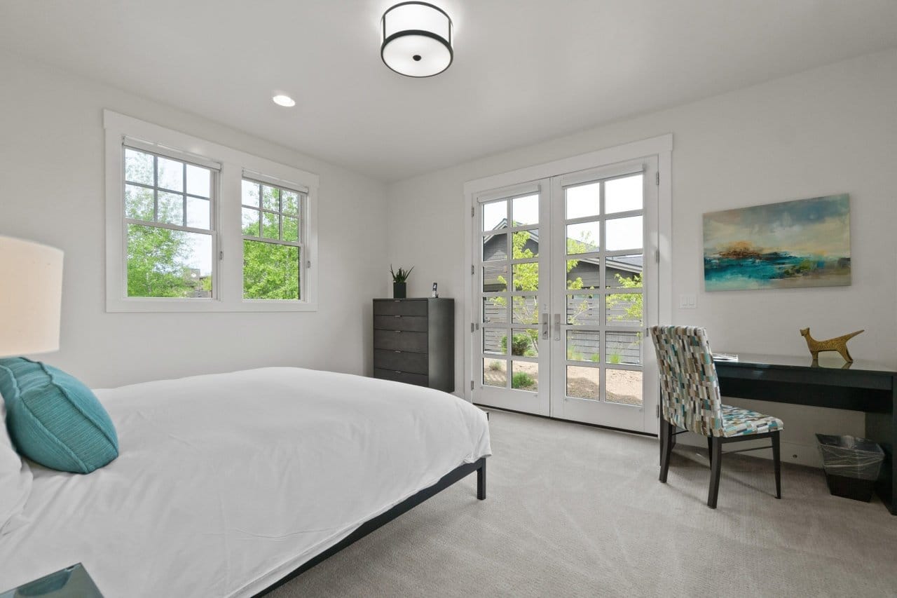 Minimalist bedroom with French doors.