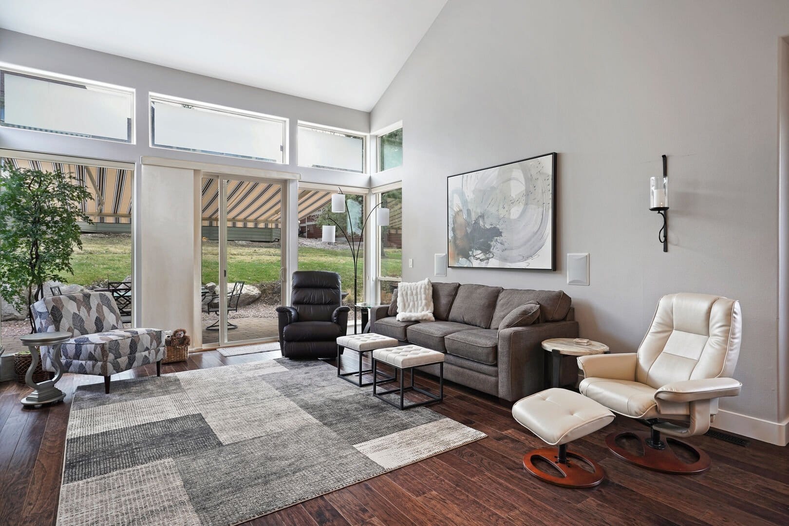 Modern living room with large windows.