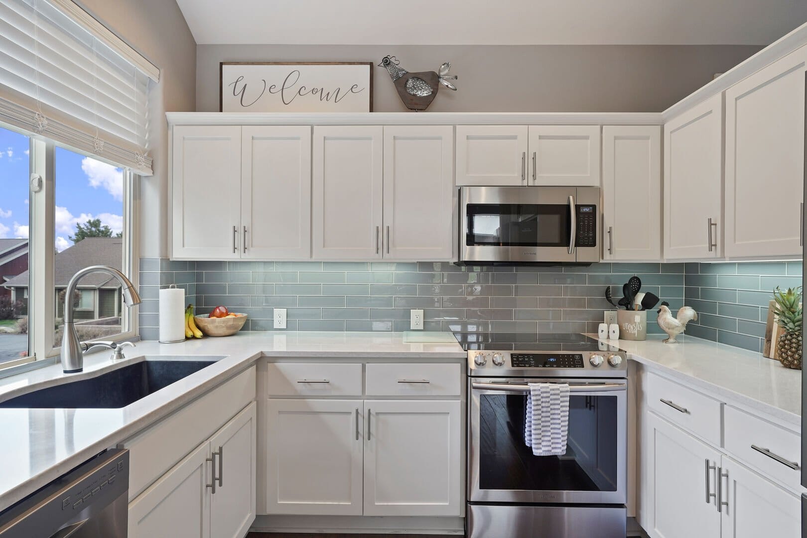 Modern kitchen with white cabinets.