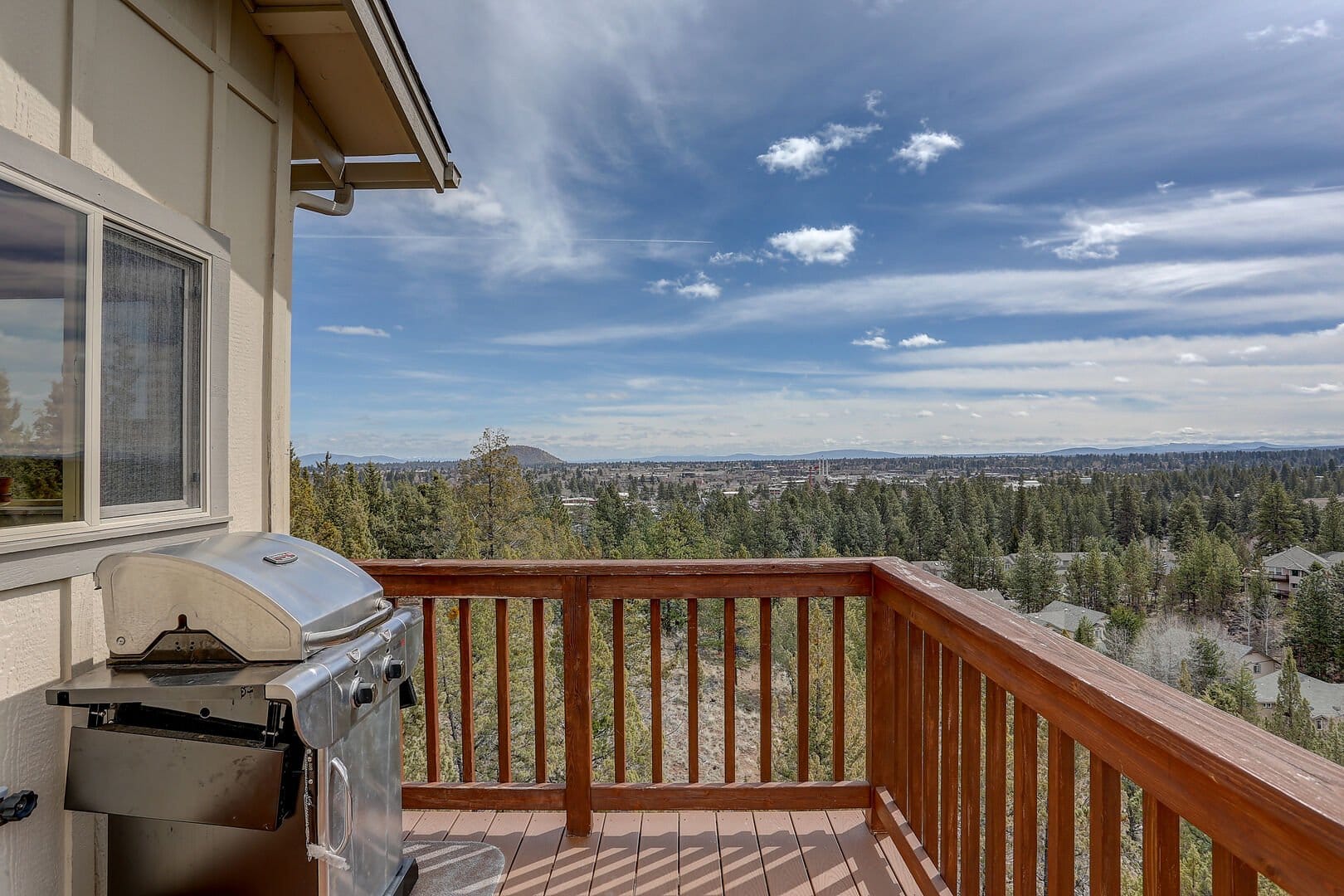 Balcony with grill and view.