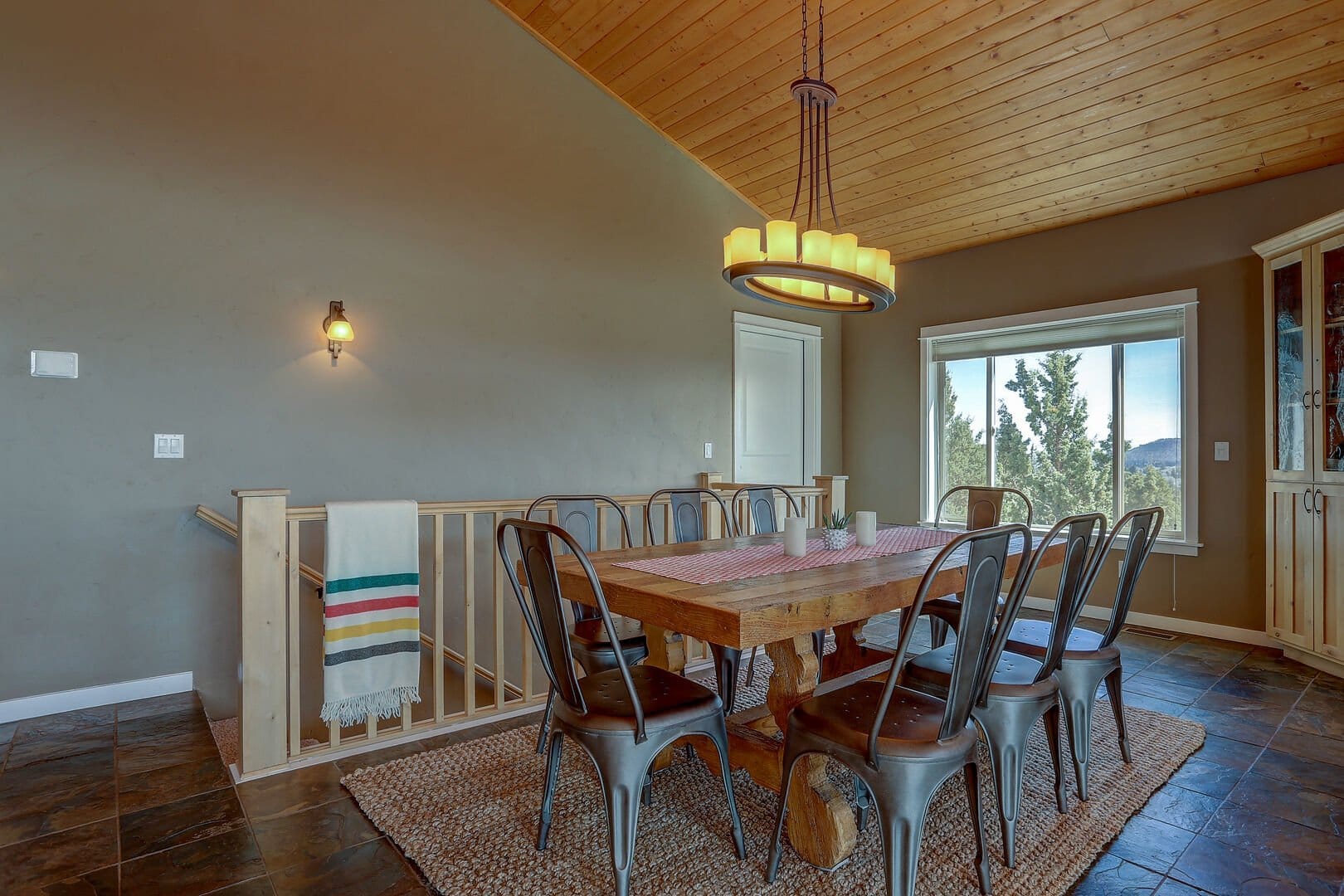 Rustic dining room with wooden table.