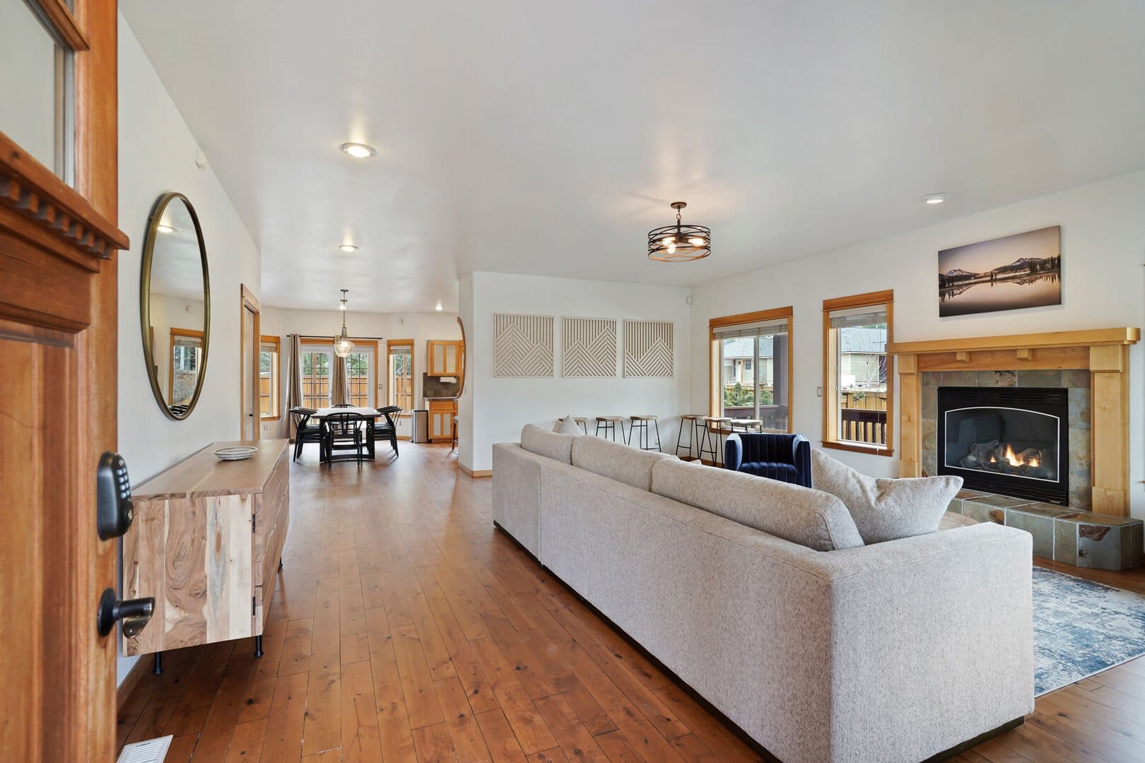 Open-concept living dining area with fireplace.