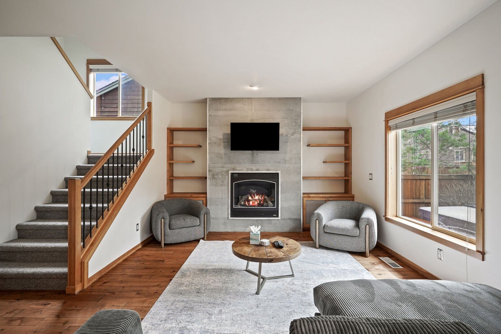 Modern living room with fireplace.