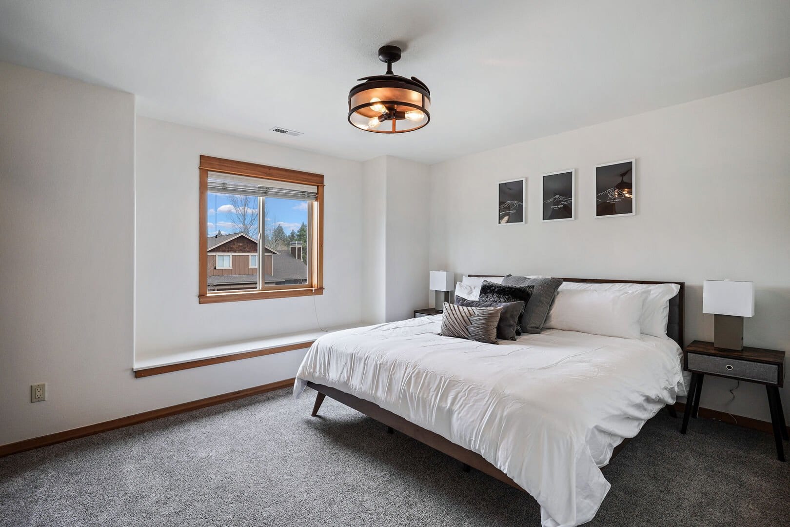 Modern bedroom with large window.