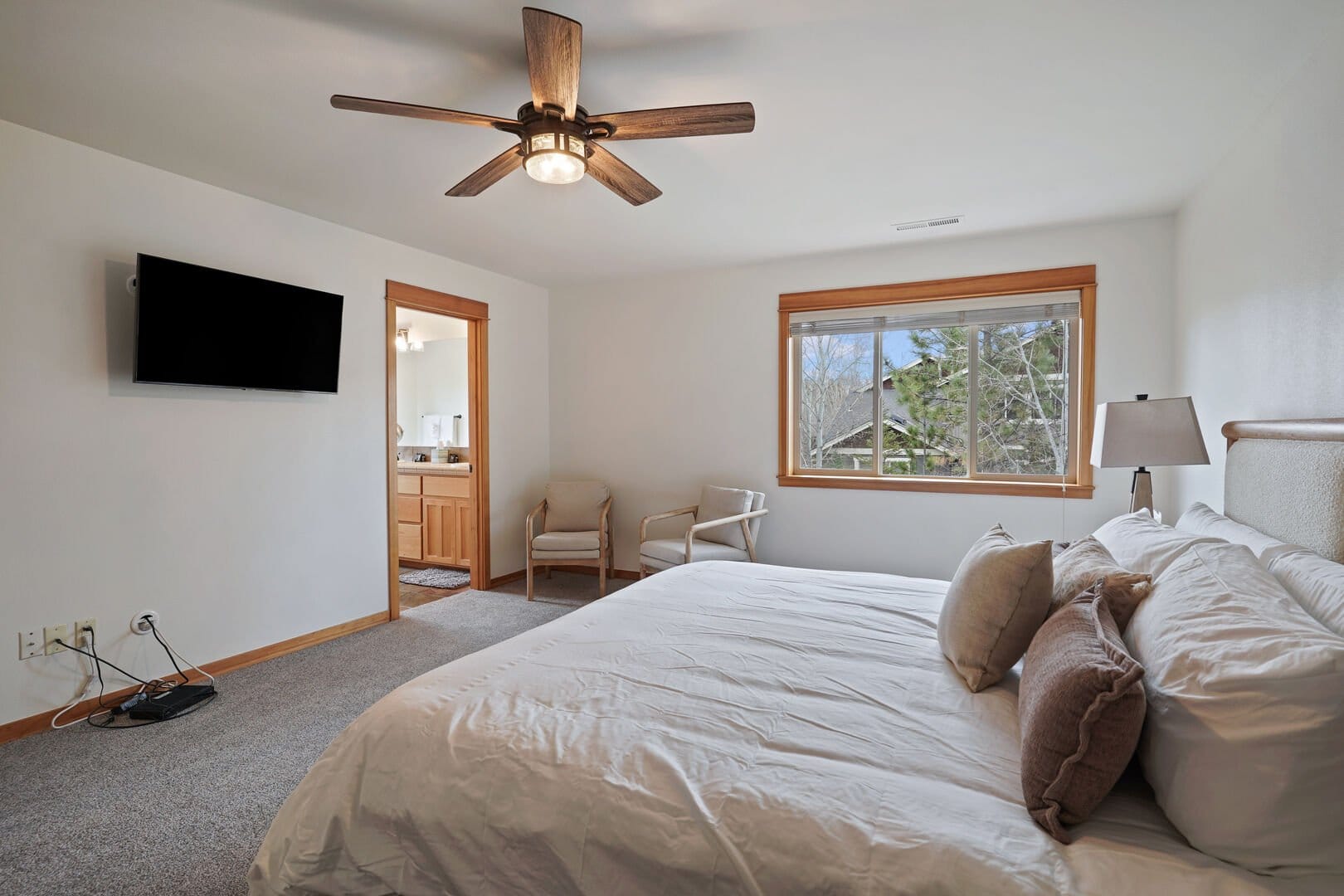 Bedroom with bed, window, furniture.