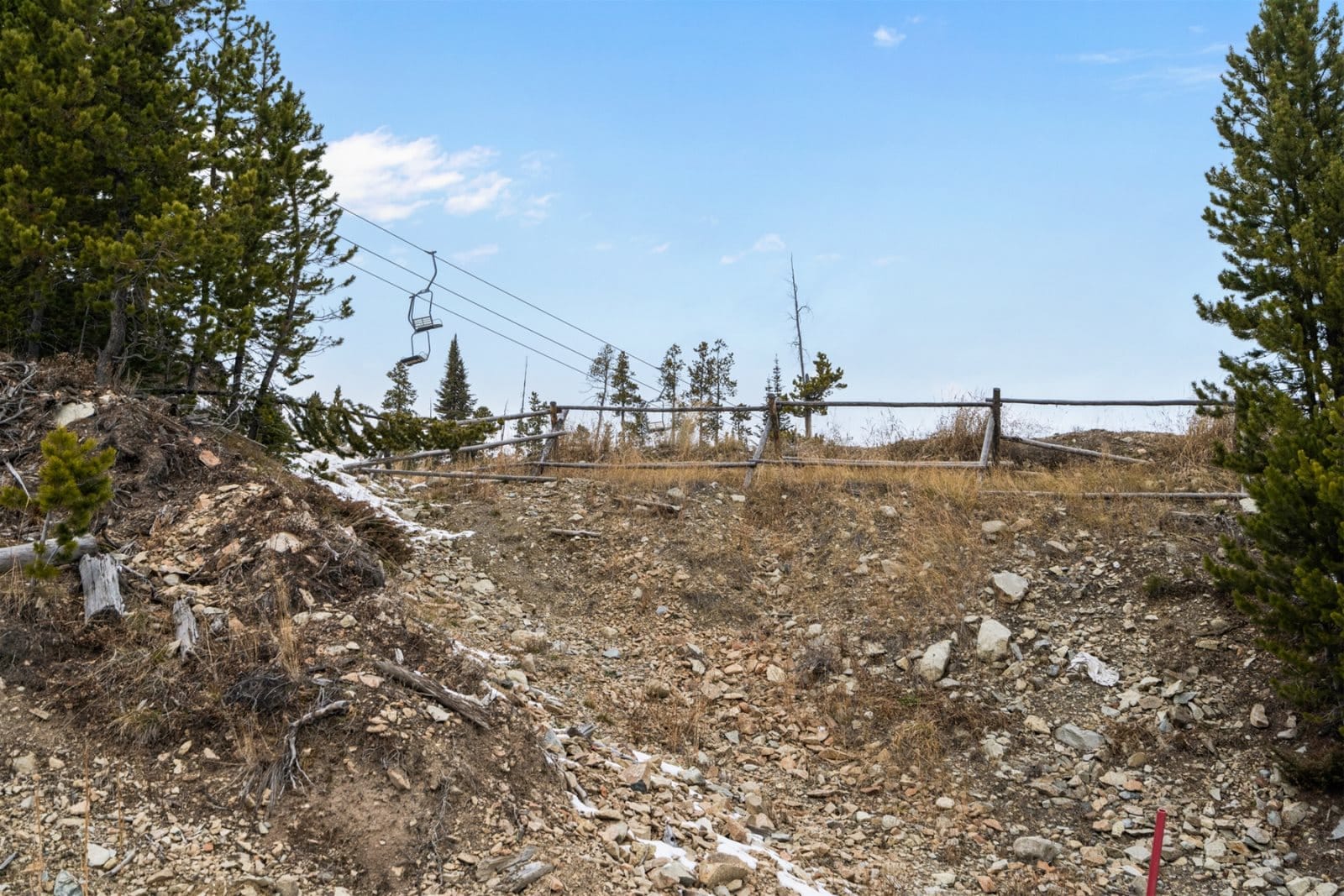 Abandoned ski lift in mountainous area.