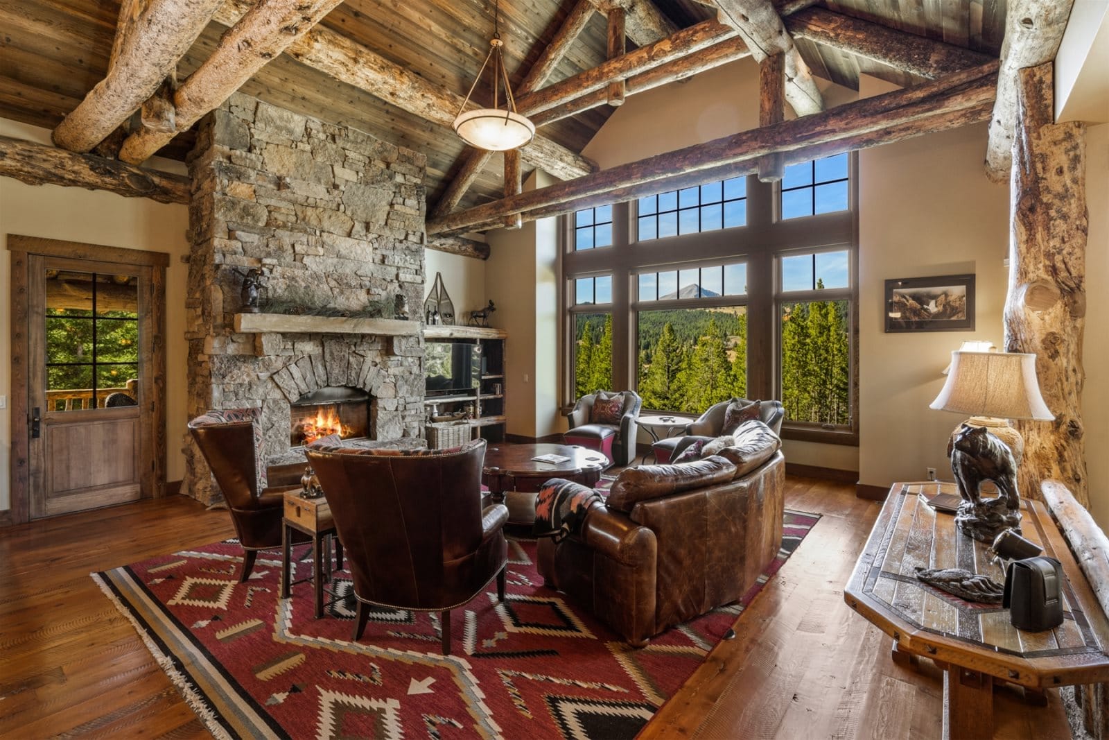 Rustic living room with stone fireplace.