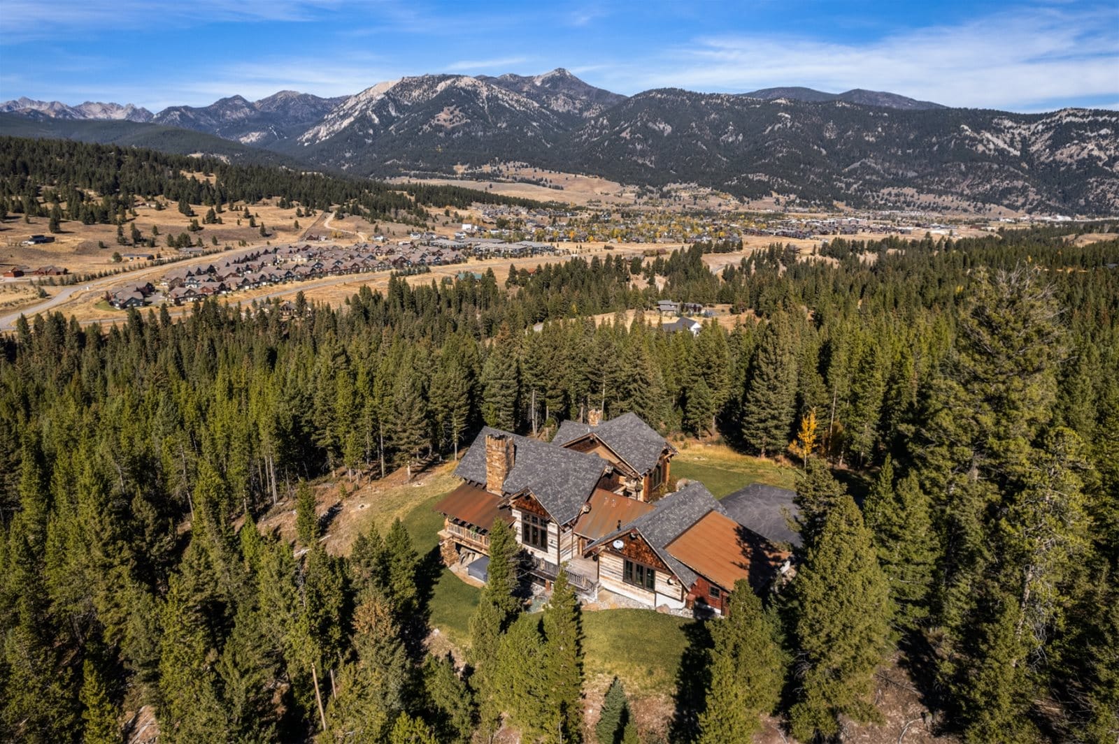 Mountain home surrounded by forest.