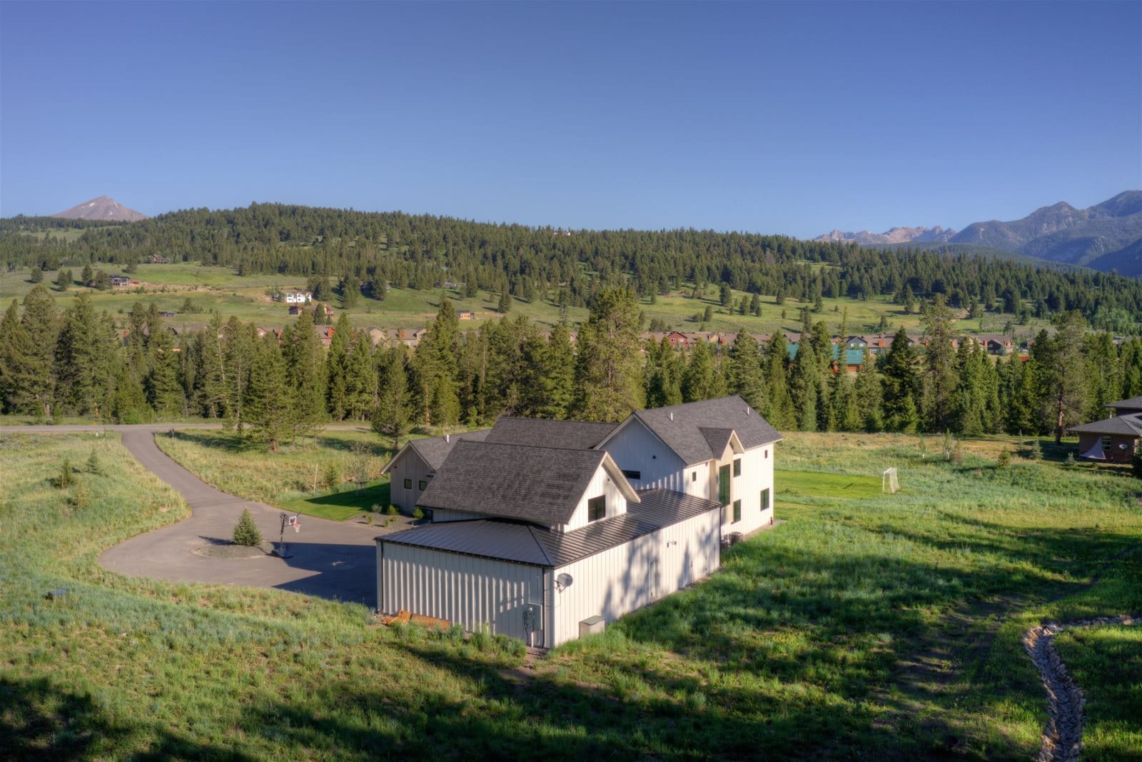 Mountain home surrounded by forest.