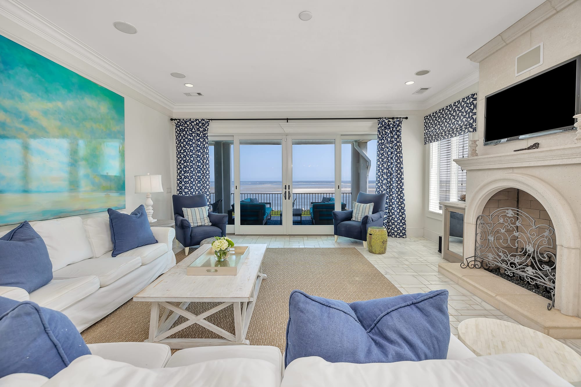 Sea-view living room with fireplace.