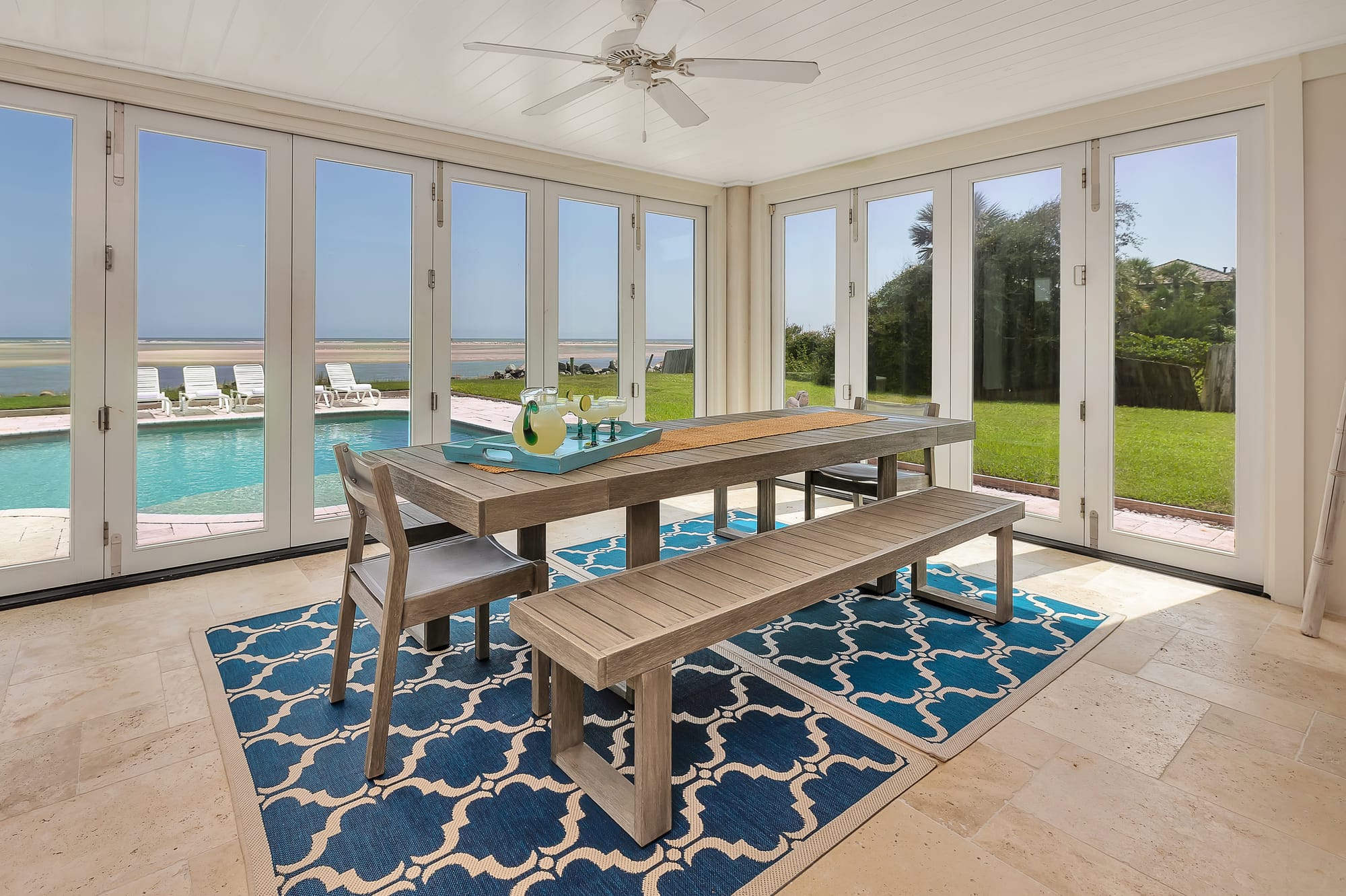 Dining area overlooking pool and ocean.