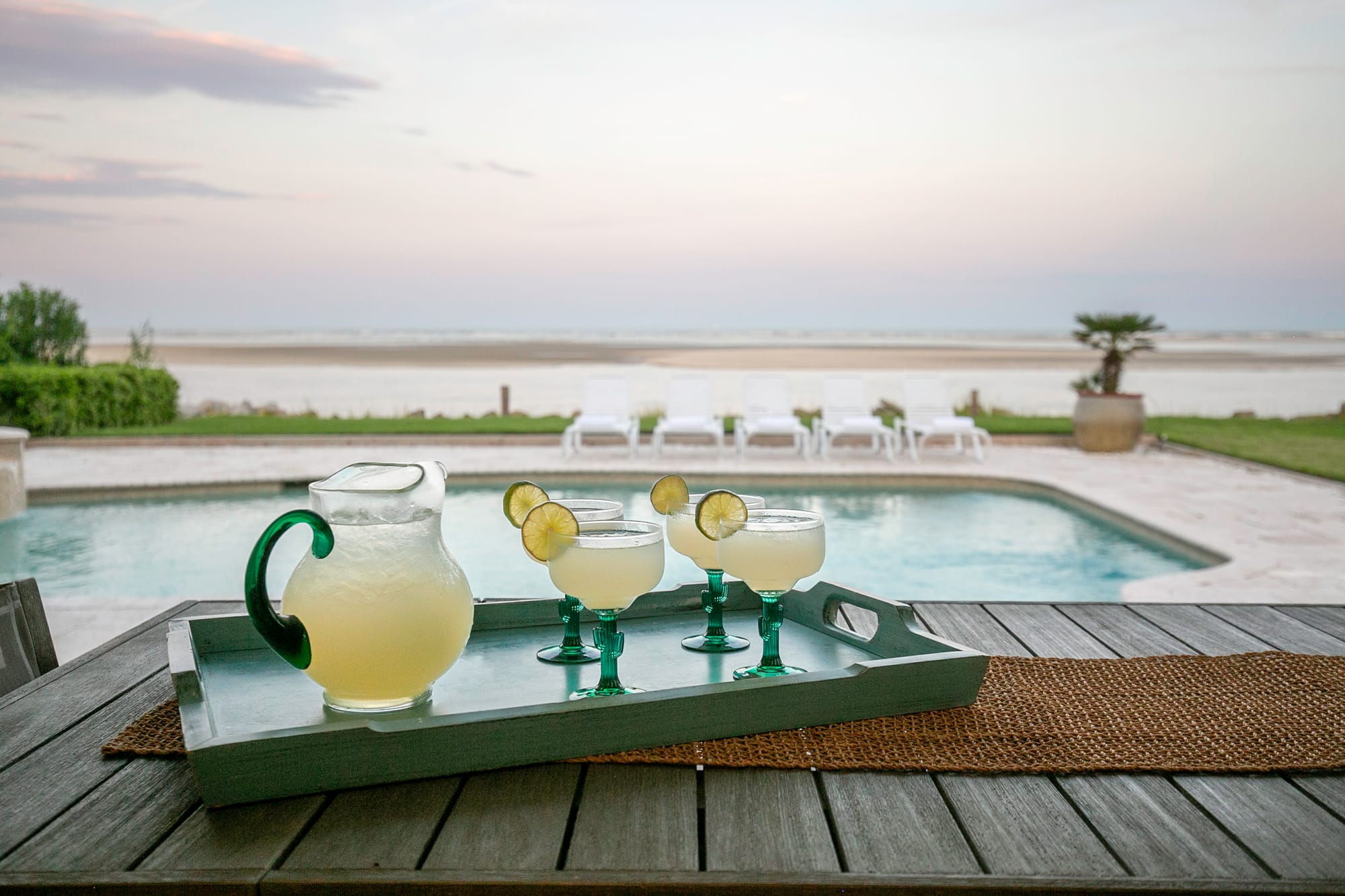 Poolside drinks with ocean view.