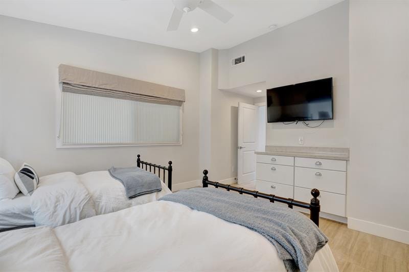 Modern bedroom with two beds.