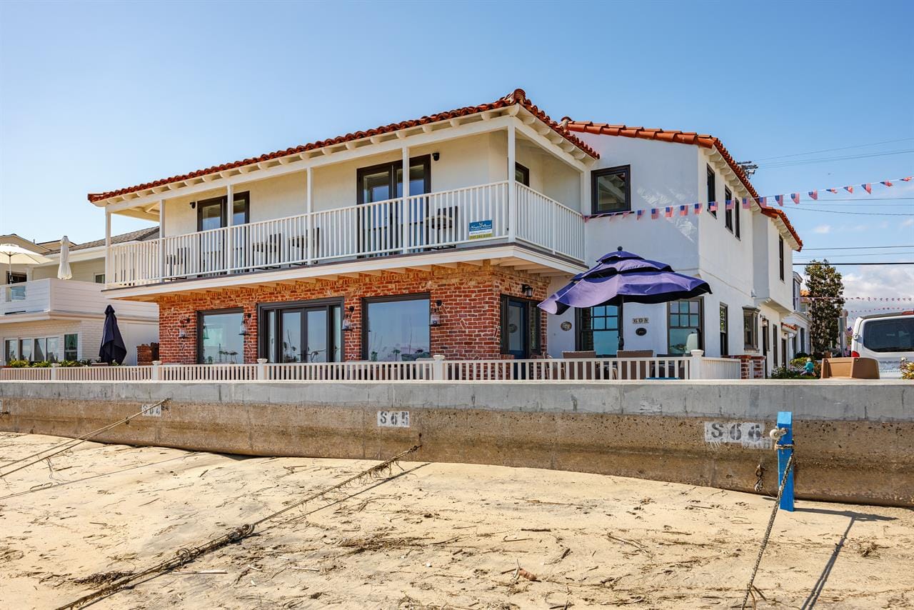 Beachfront house with large balcony.