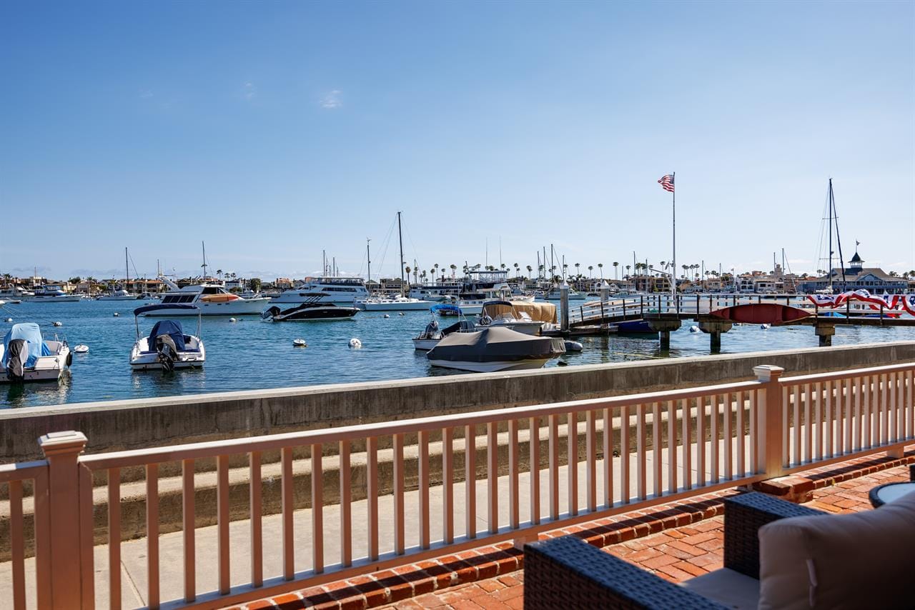 Boats docked in a sunny marina.