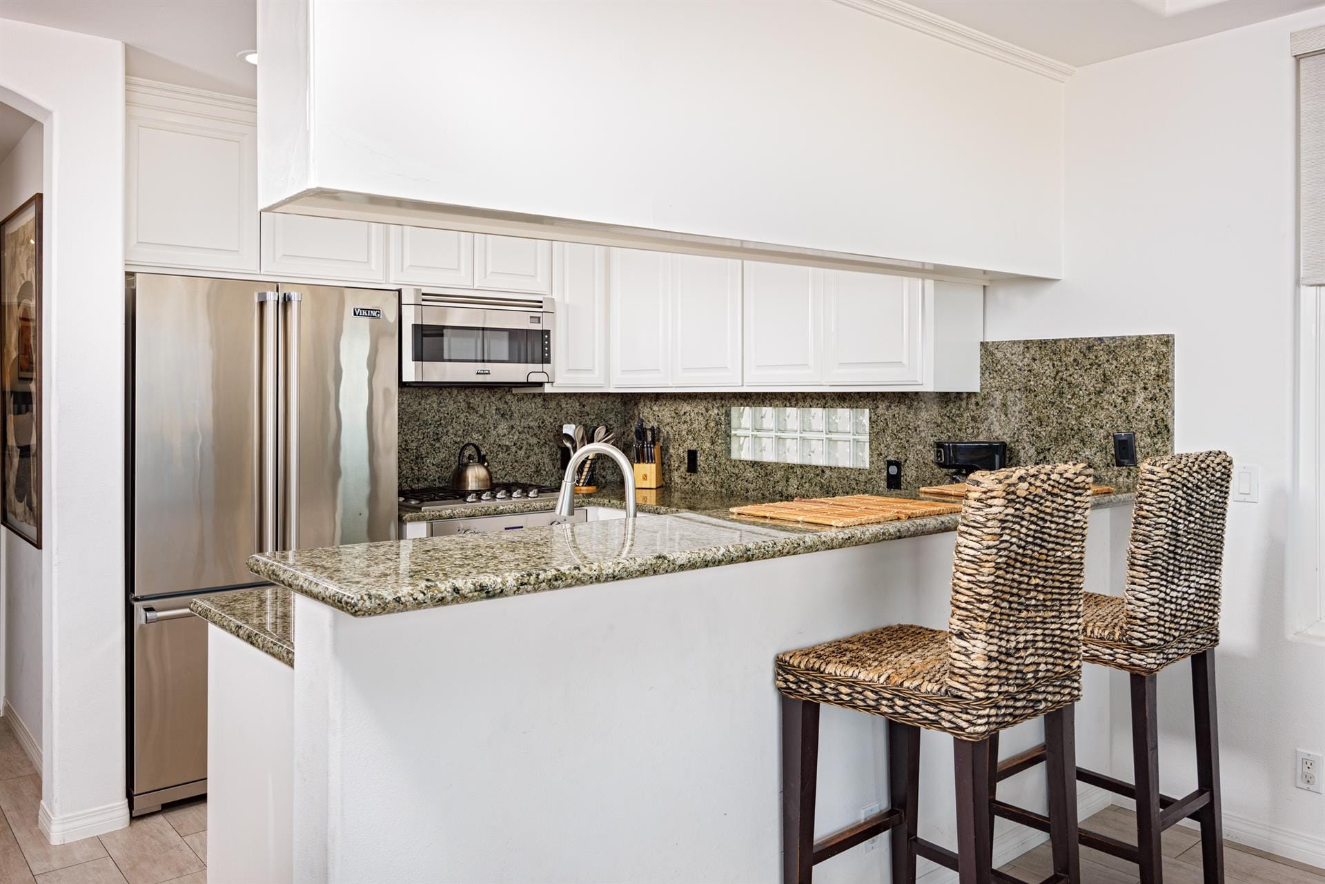 Modern kitchen with two barstools.