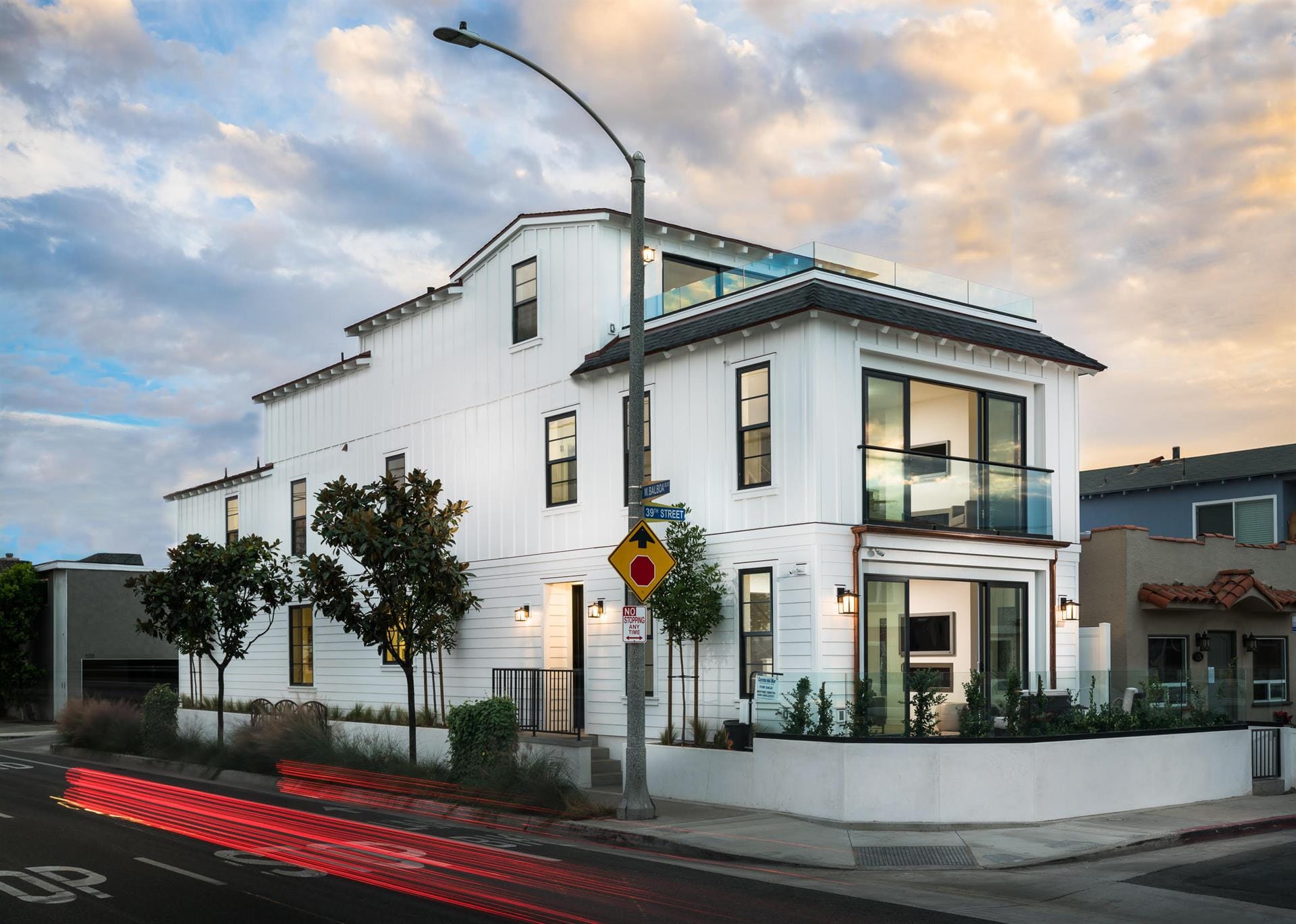 Modern white house on street corner.