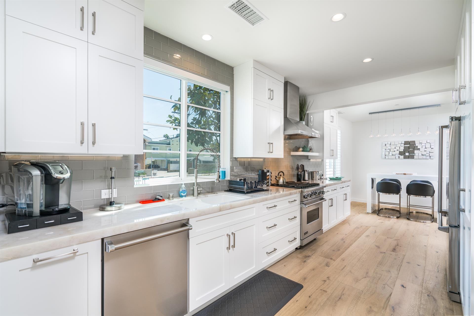 Modern kitchen with white cabinets.