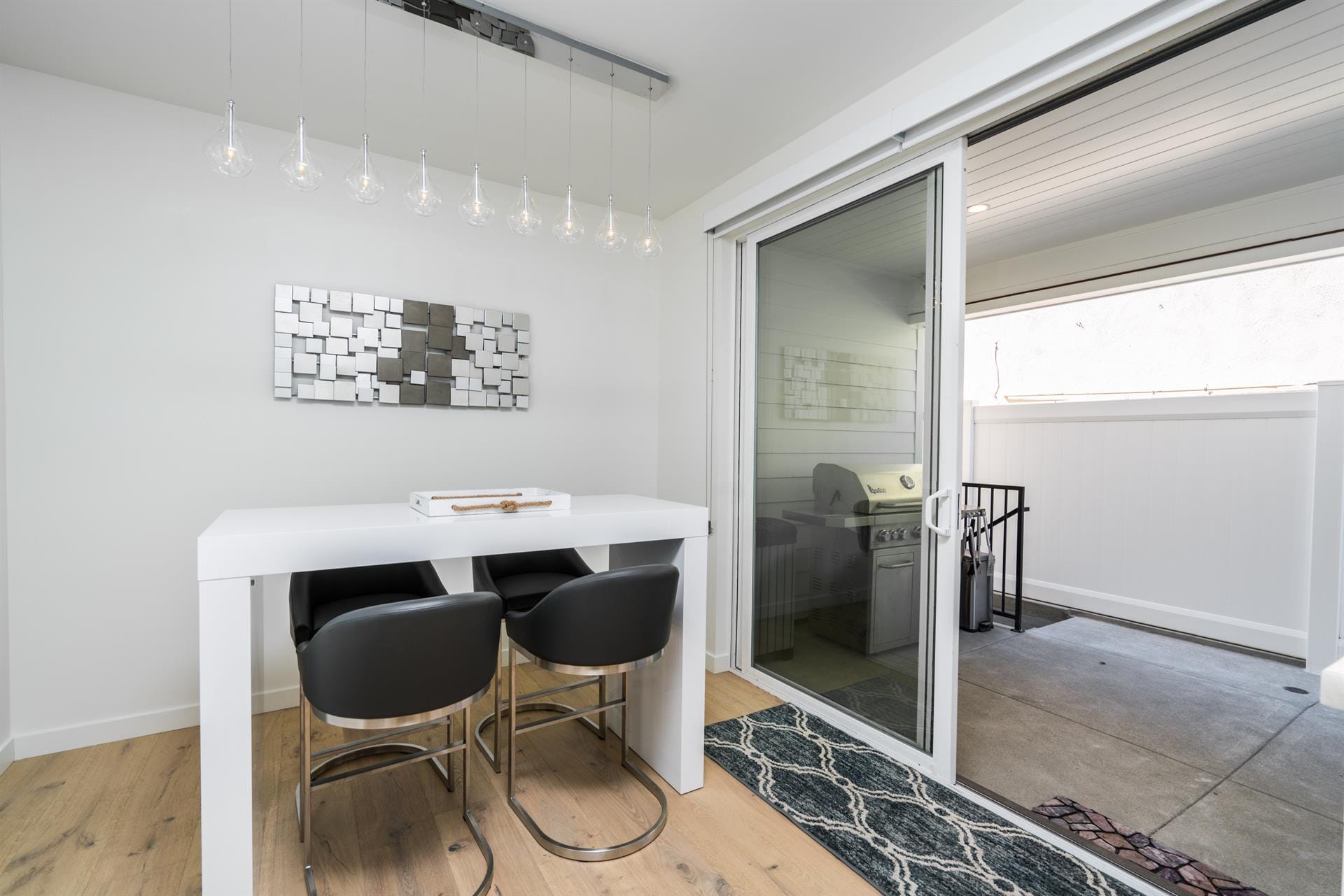 Modern dining area with sliding doors.