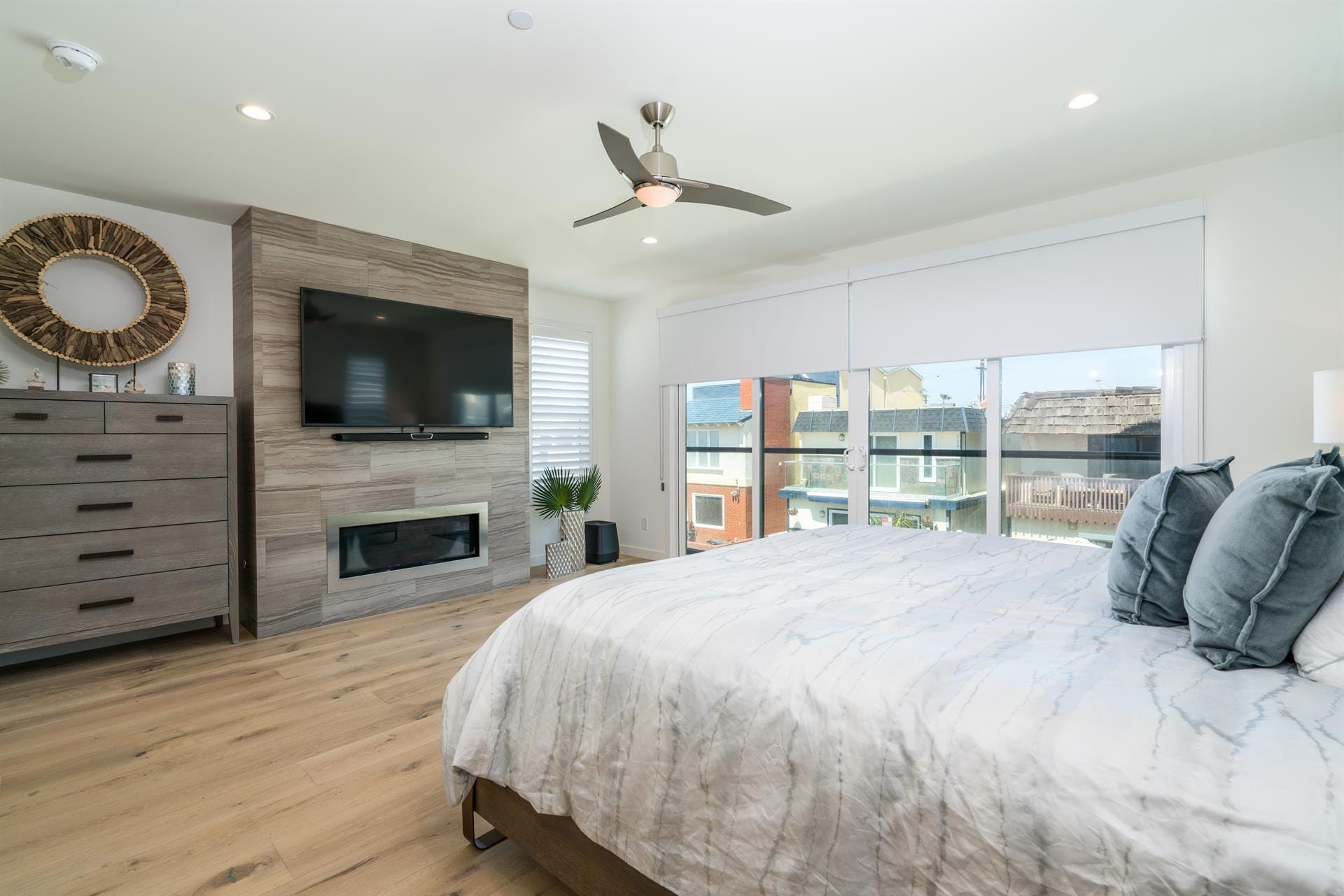 Modern bedroom with large window.