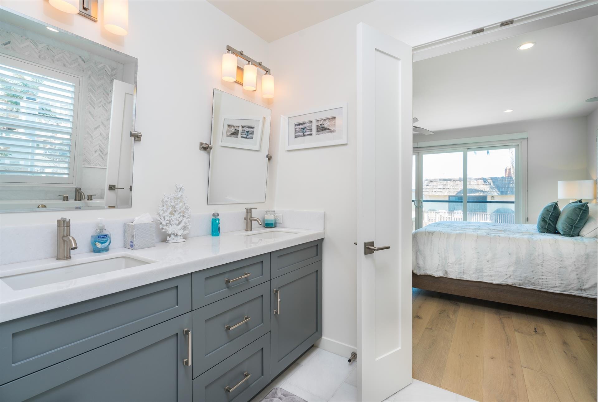 Modern bathroom and adjacent bedroom.