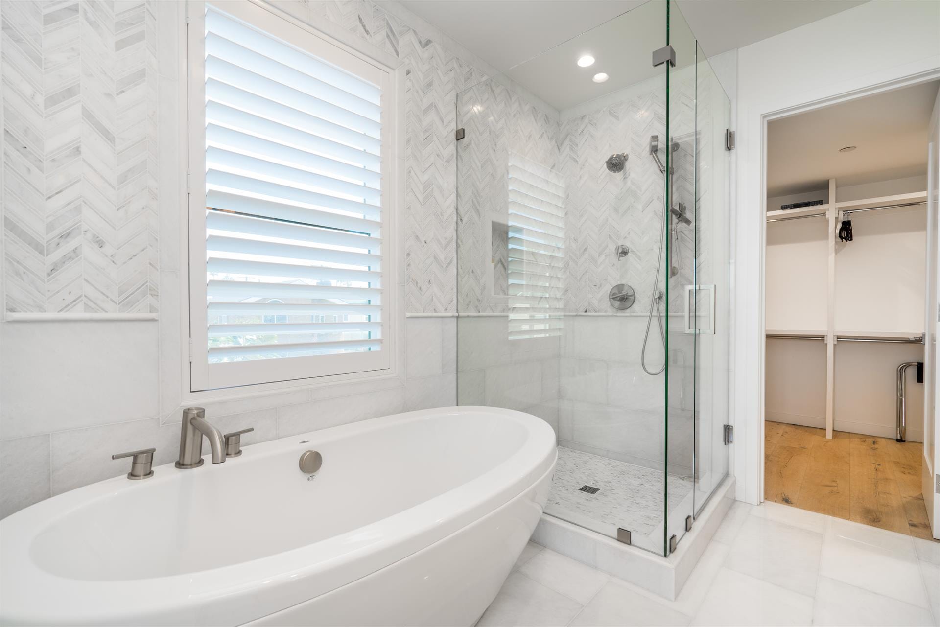 Modern bathroom with tub, shower.