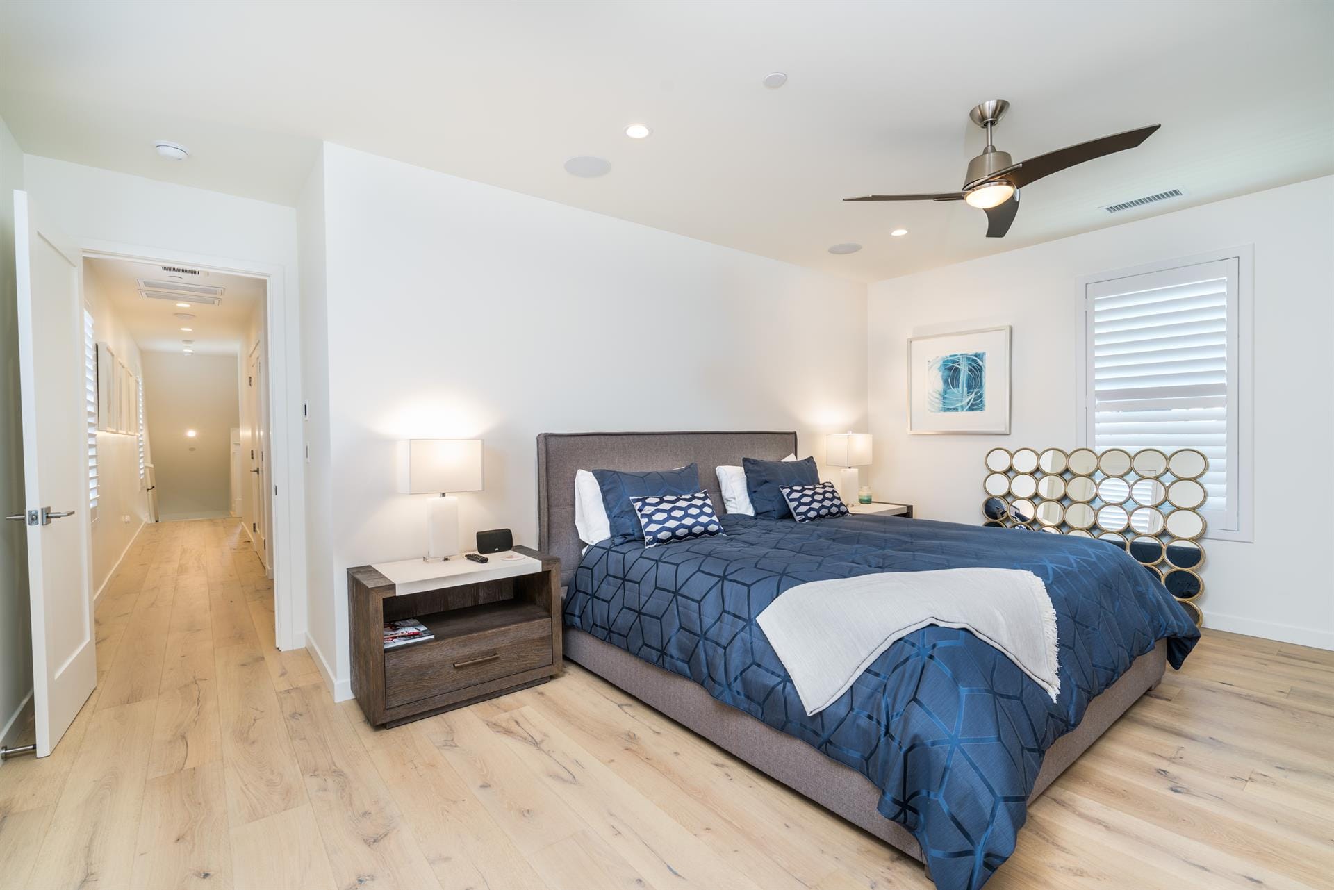 Modern bedroom with blue bedding.