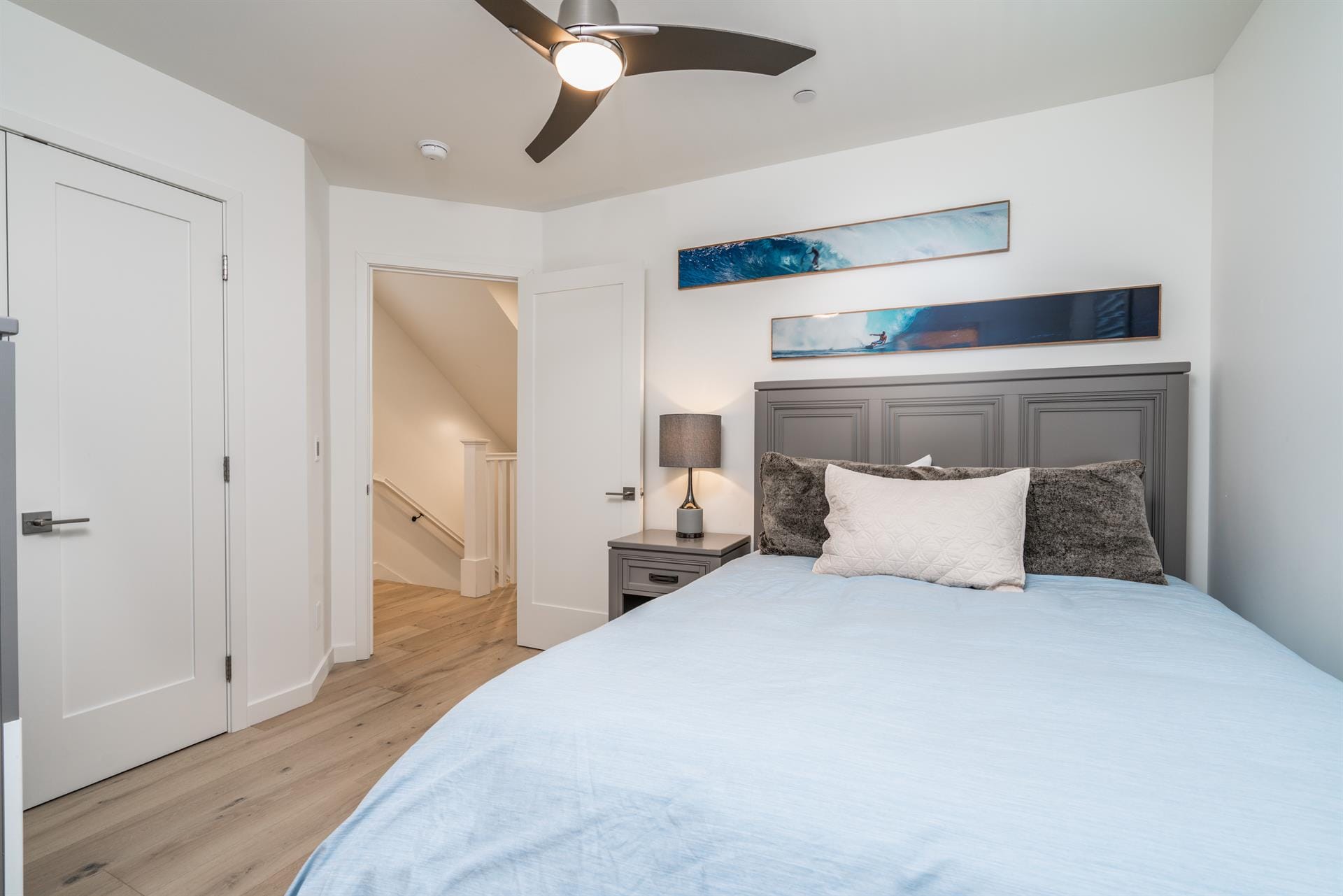 Modern bedroom with blue bedding.