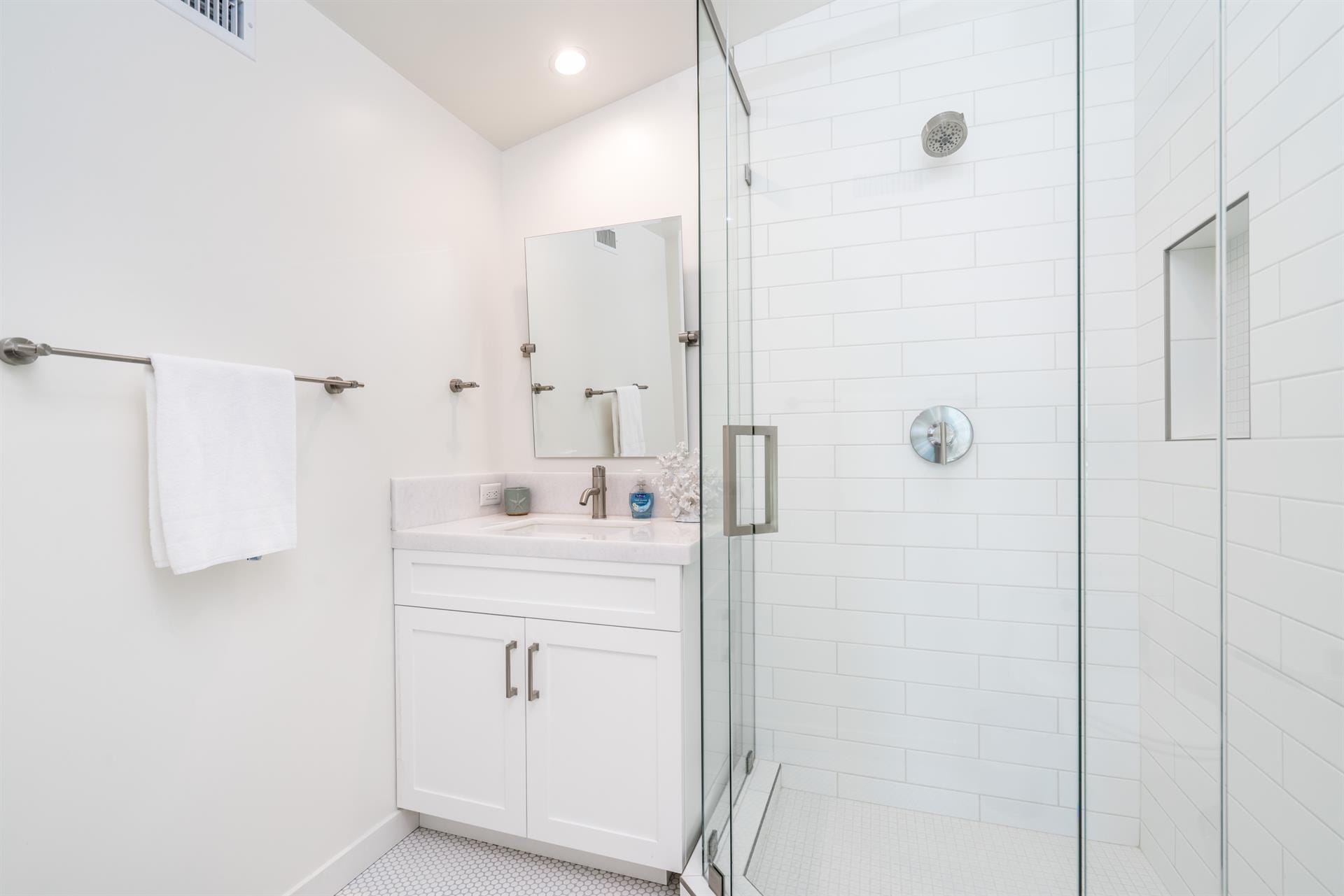 Modern white bathroom with shower.