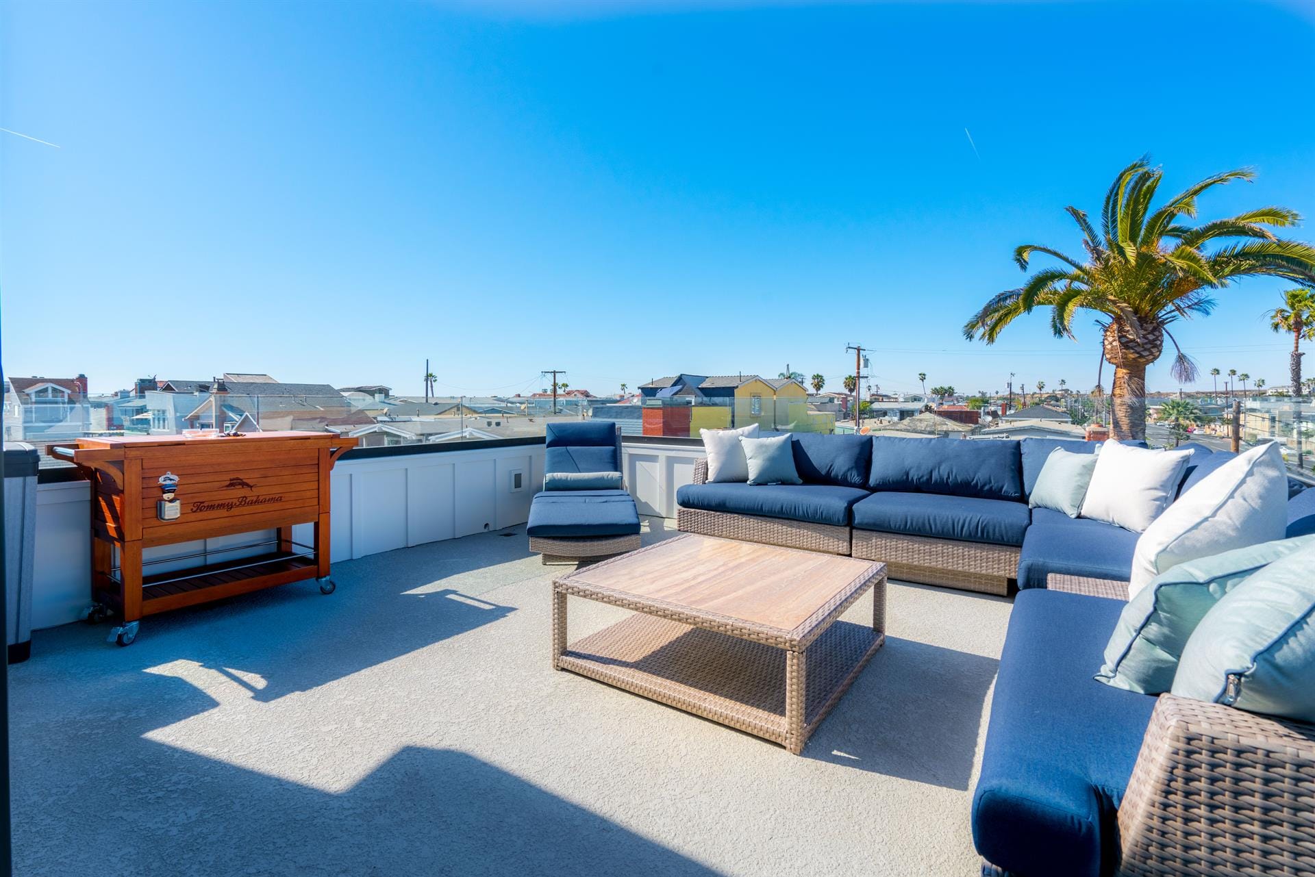 Rooftop patio with outdoor furniture.