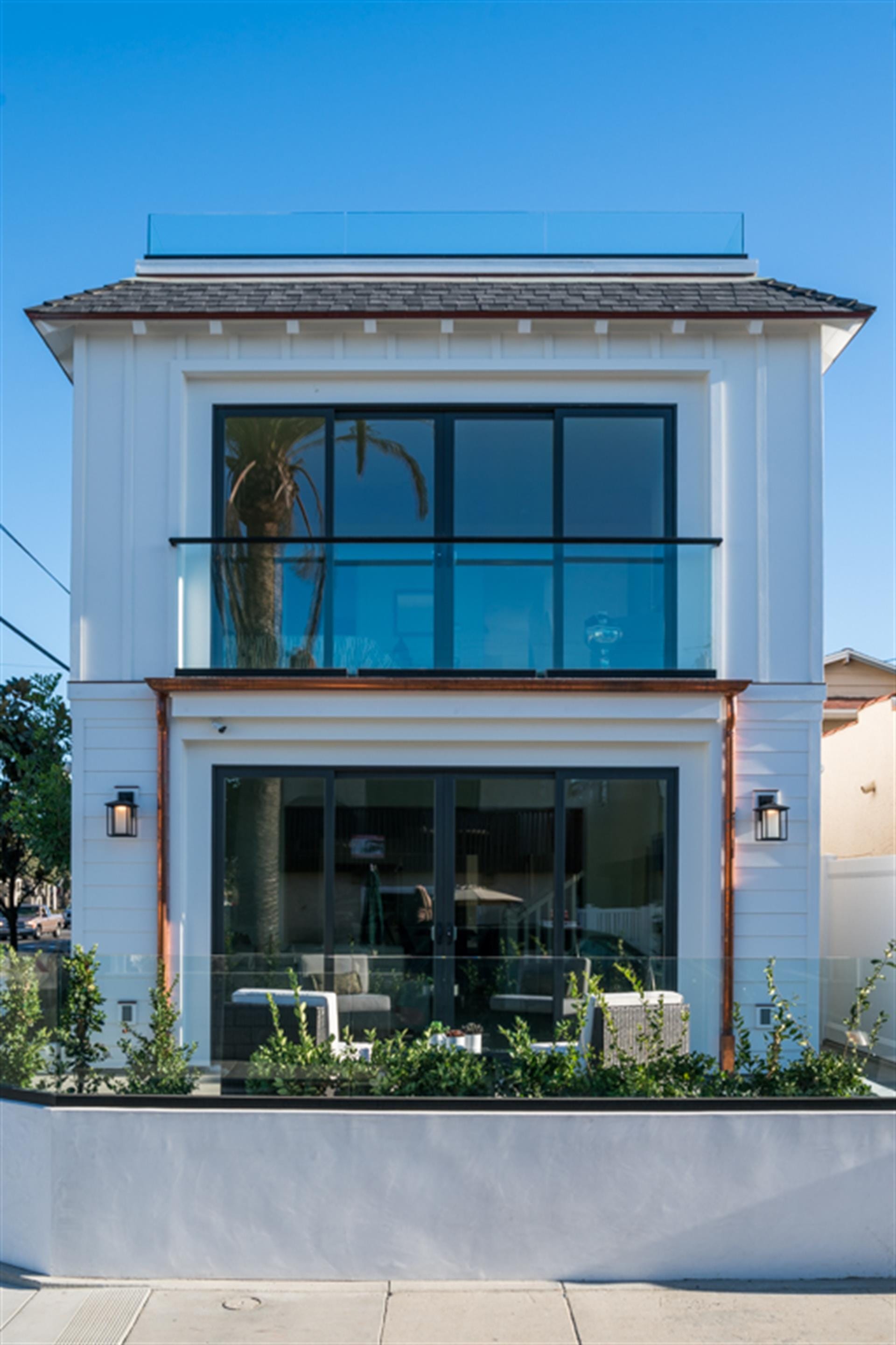 Modern two-story house with glass.