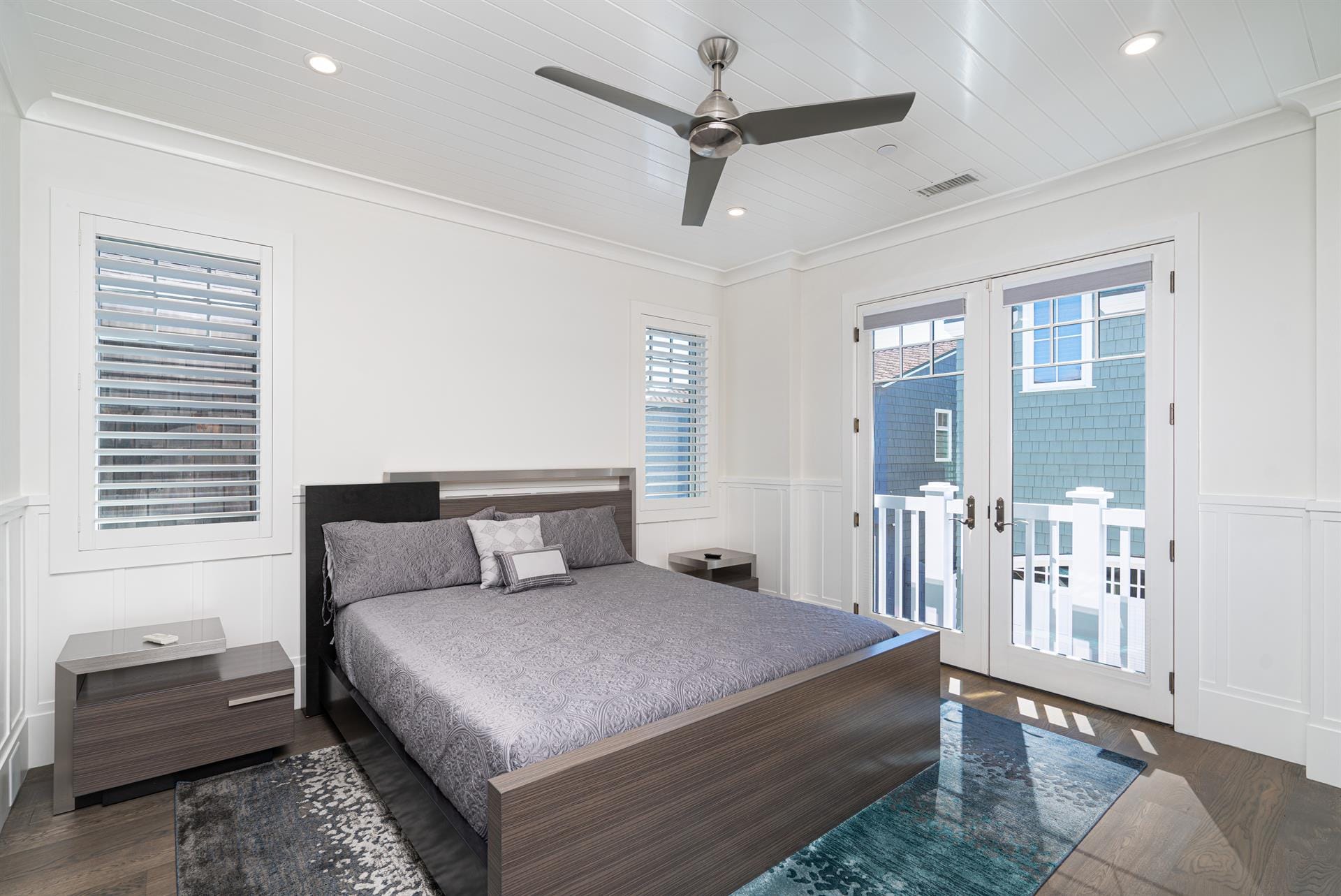 Modern bedroom with balcony access.