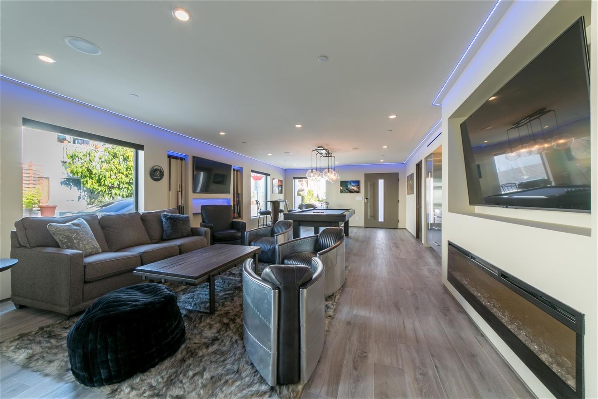 Modern living room with blue lighting.