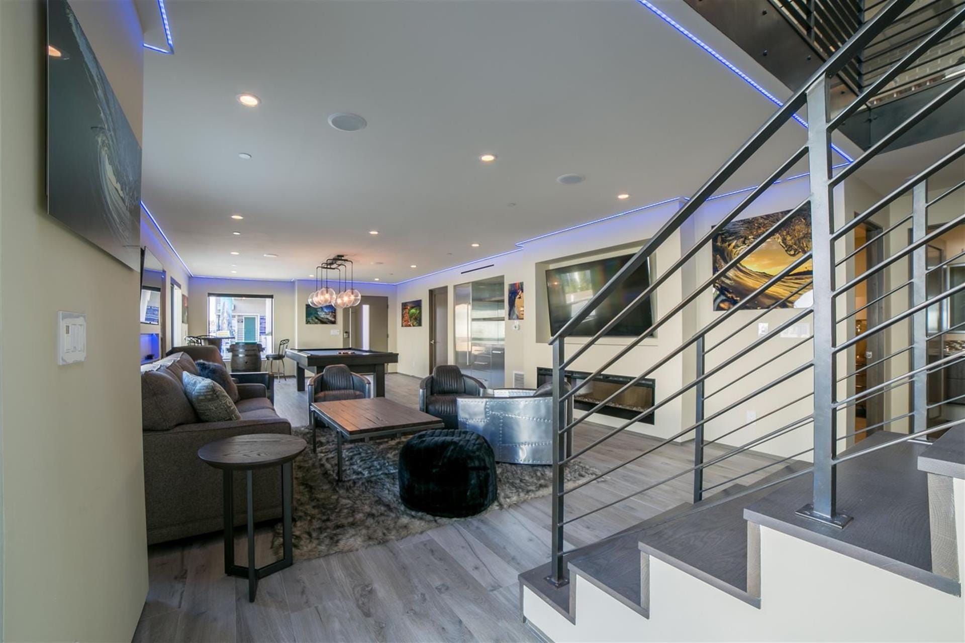 Modern living area with staircase.