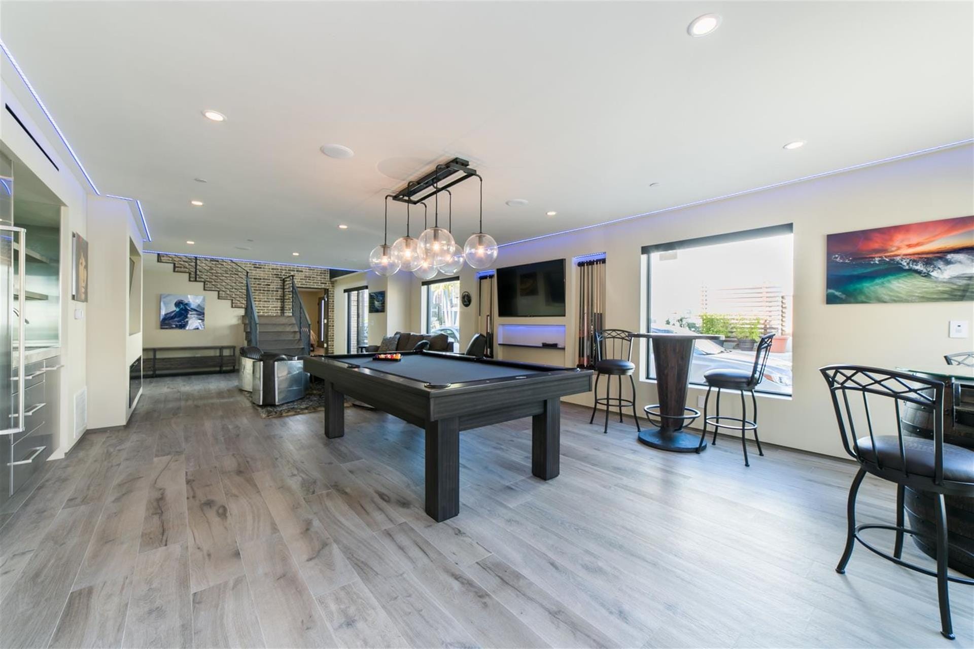 Modern game room with billiards table.