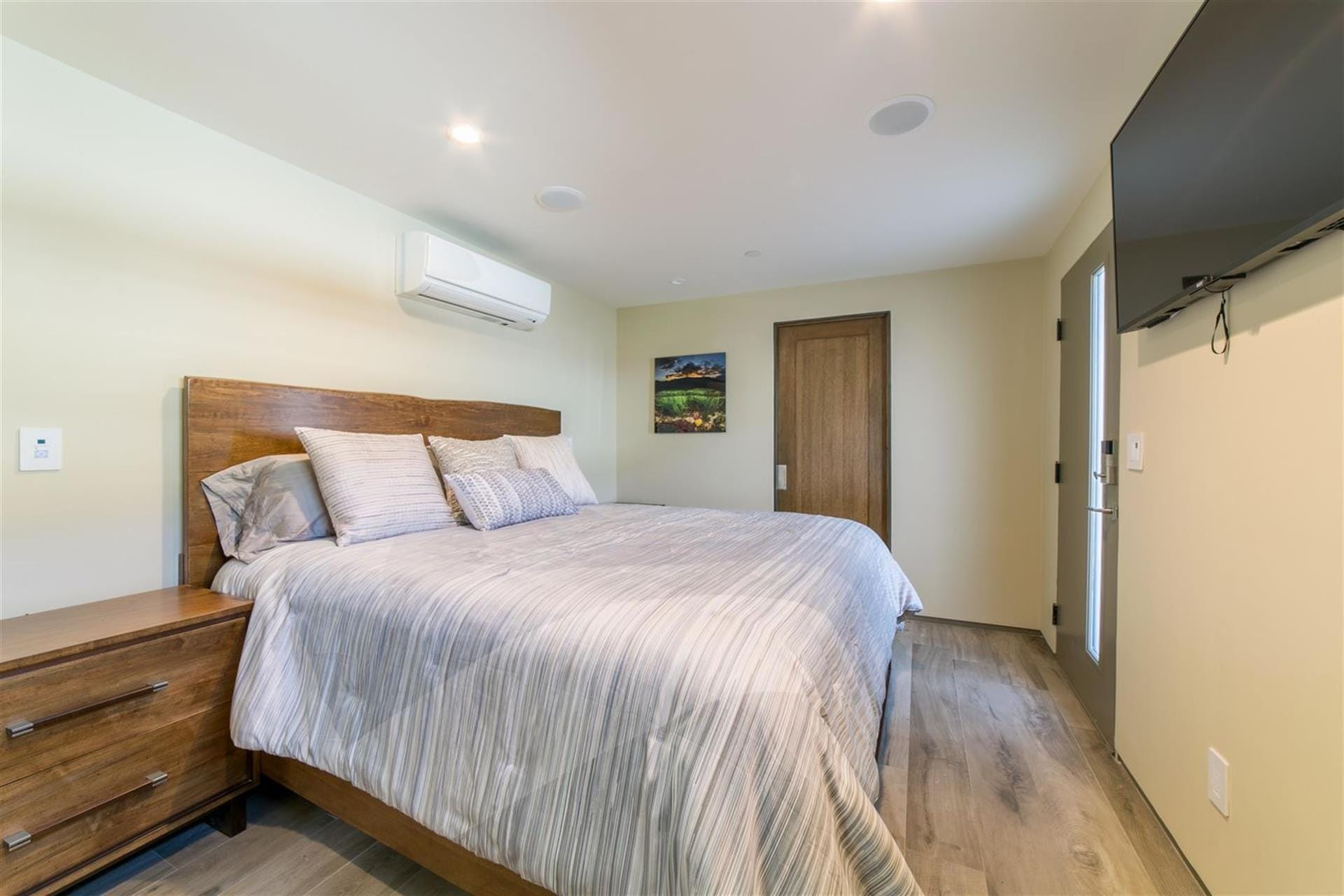 Modern bedroom with wooden accents.