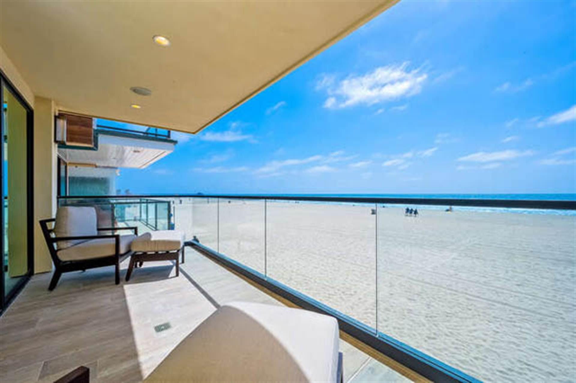 Beachfront balcony with ocean view.